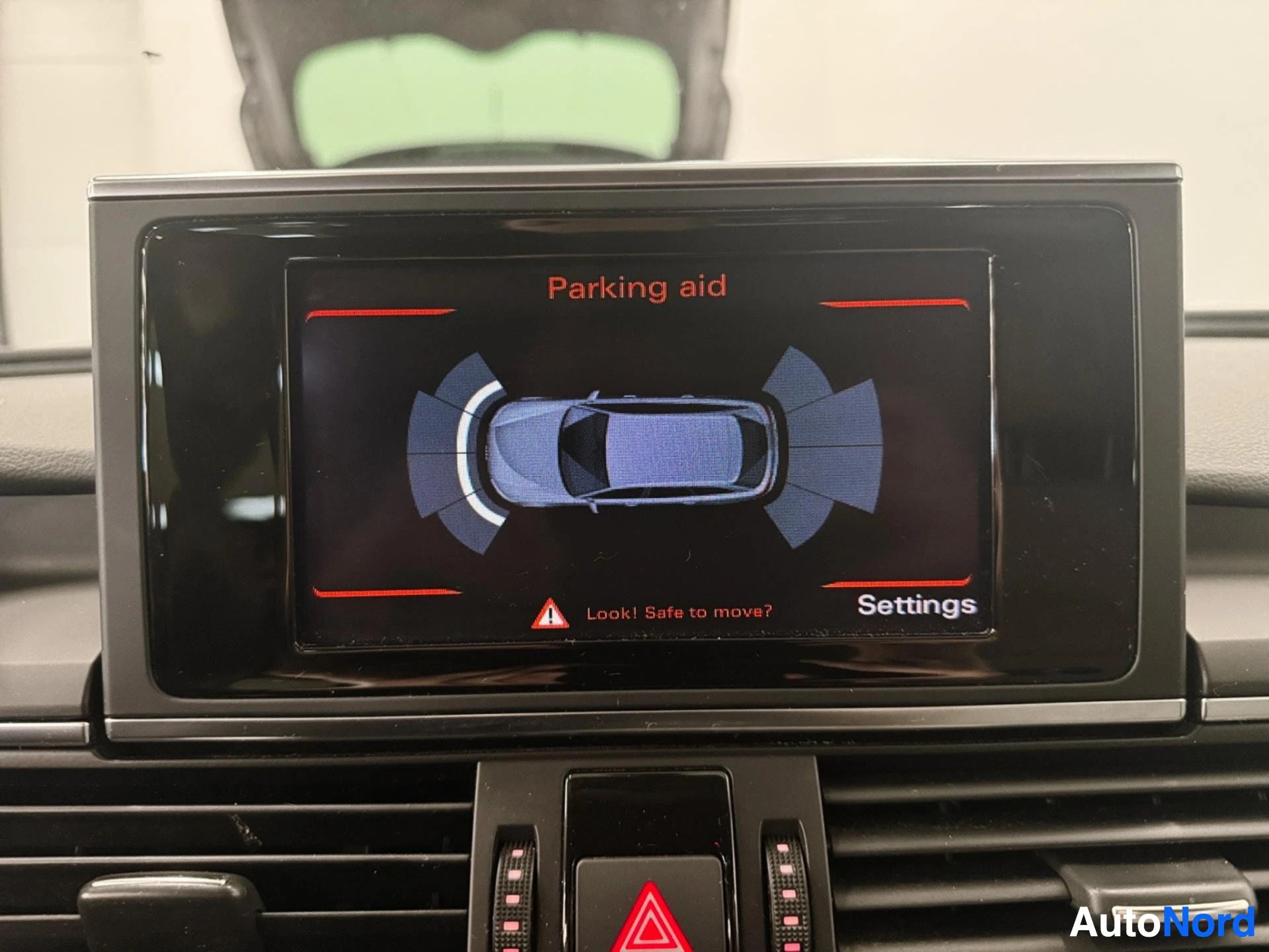 Infotainment display showing parking aid visualization from rear camera