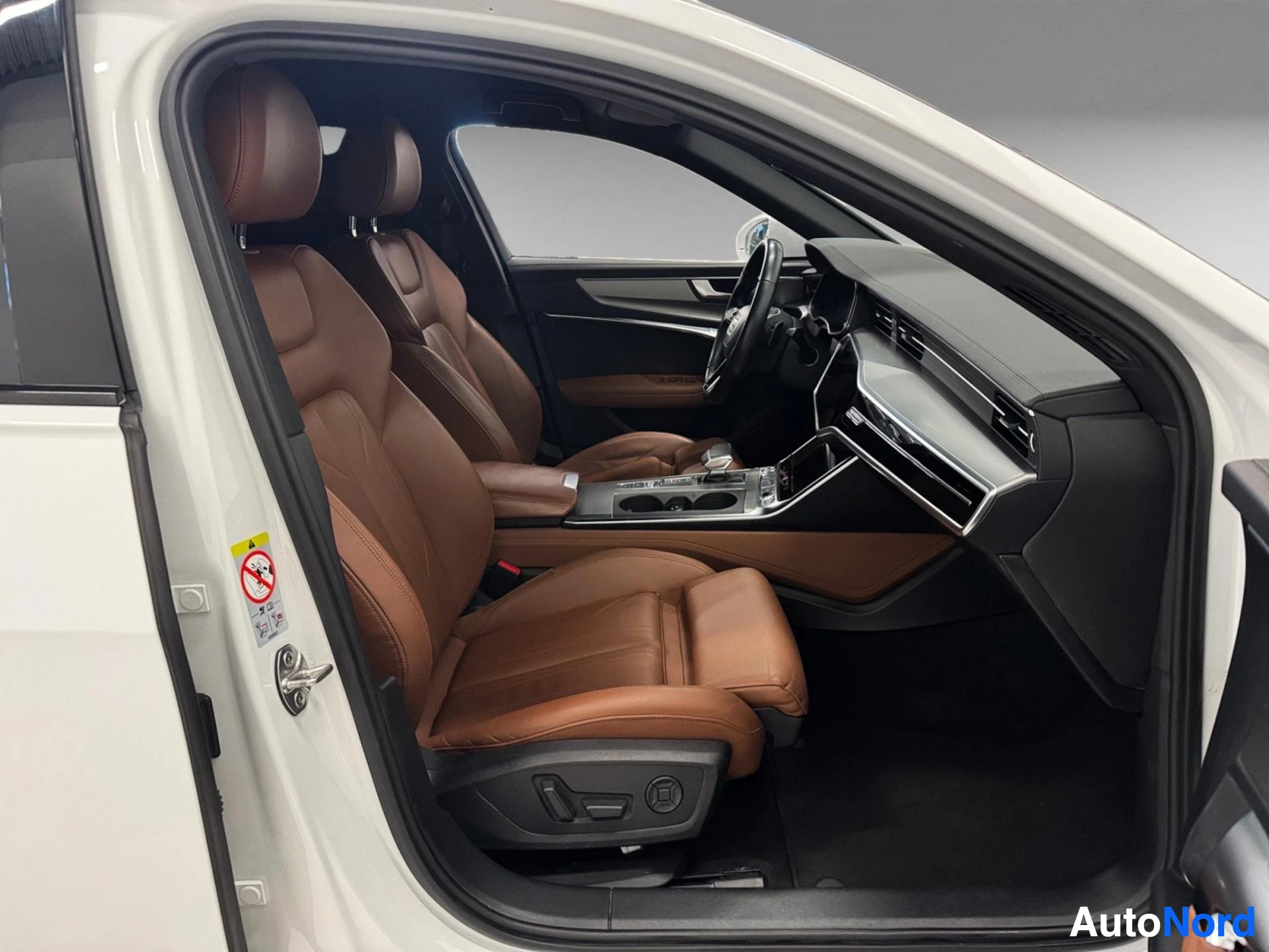Audi A6 front interior view with brown leather seats and dashboard