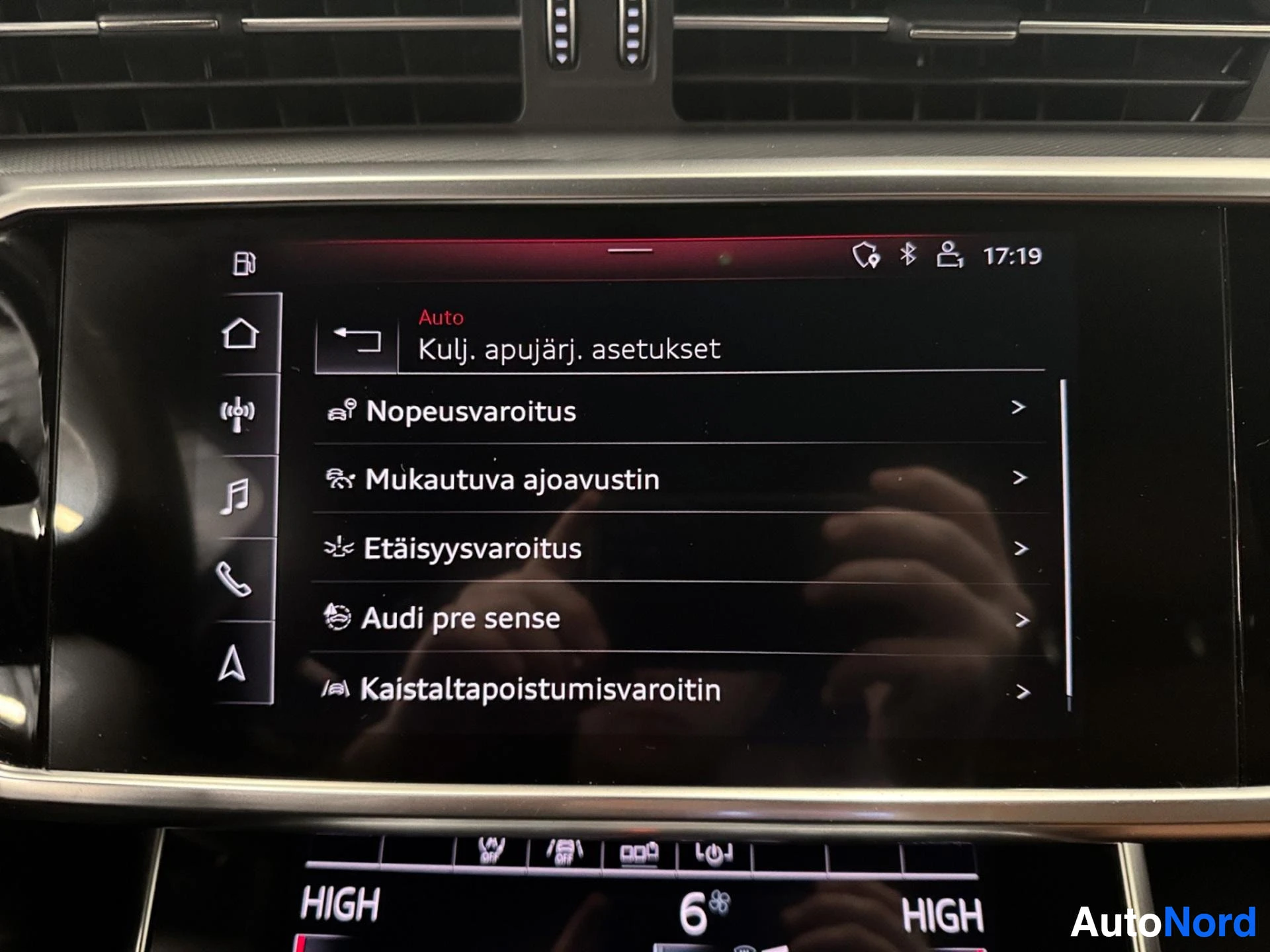 Infotainment screen showing vehicle settings menu with various options.