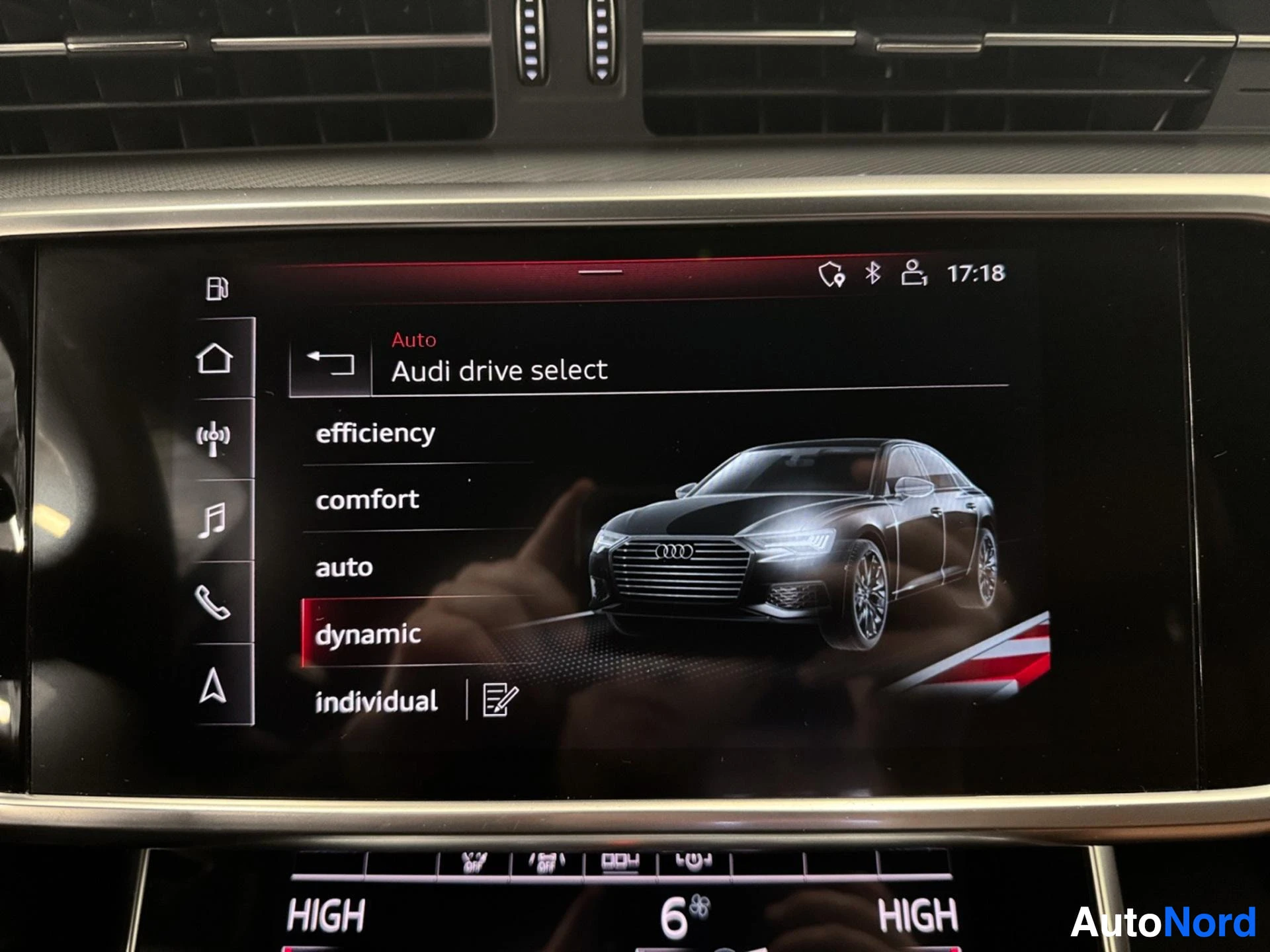 Infotainment display showing Audi drive select menu with driving modes