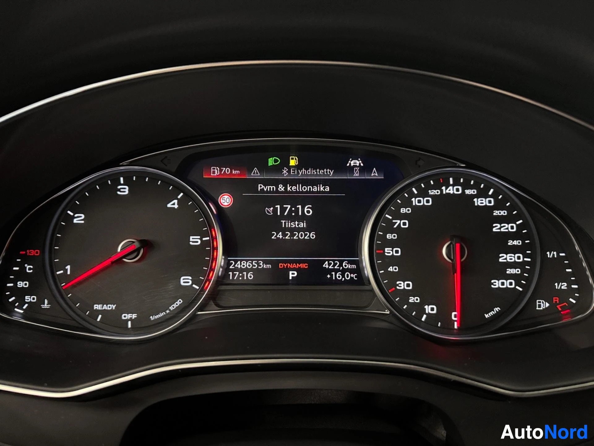 Digital instrument cluster showing speedometer, tachometer, and vehicle information display