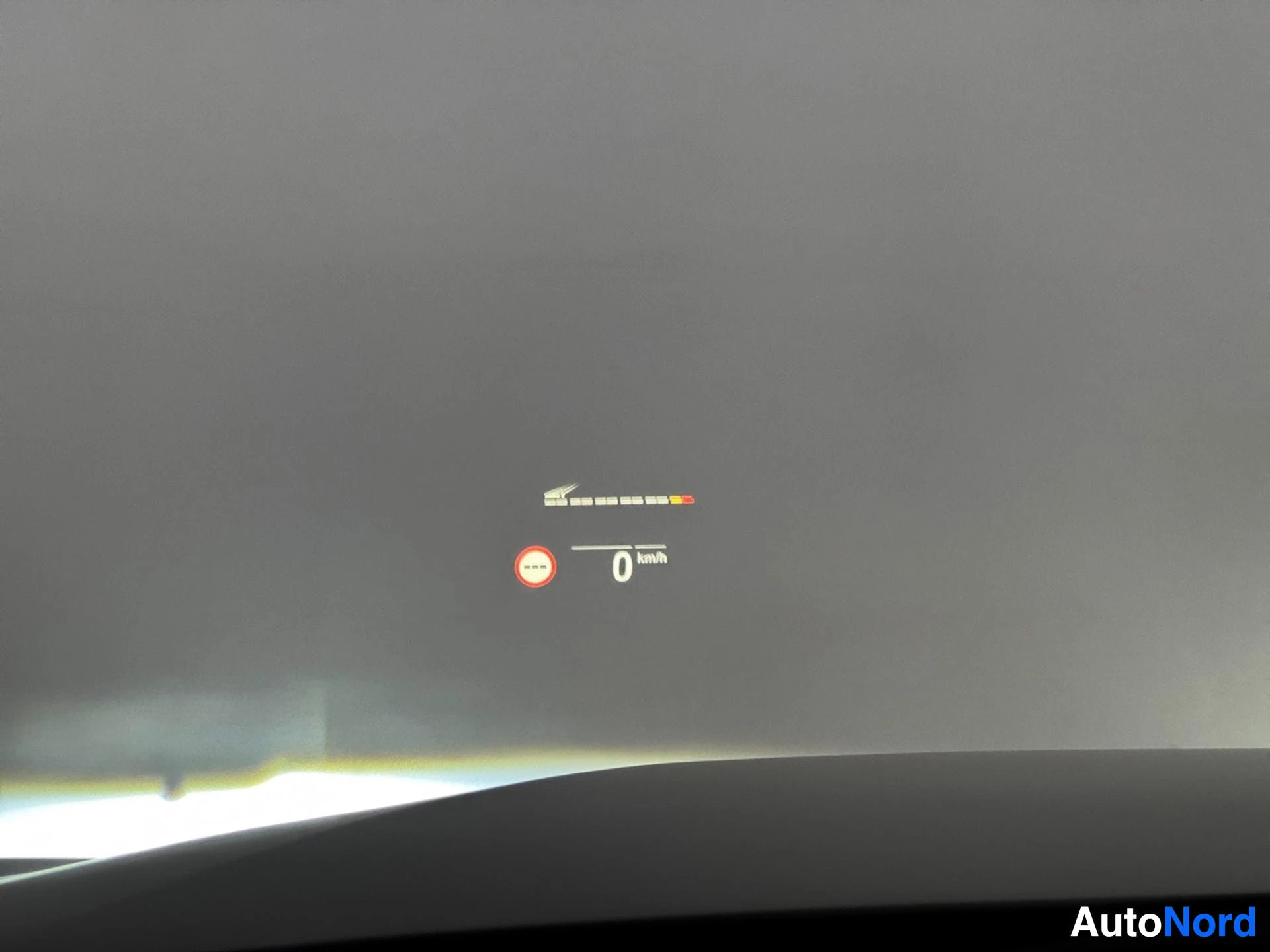 Dashboard display showing speedometer, fuel level indicator and warning lights