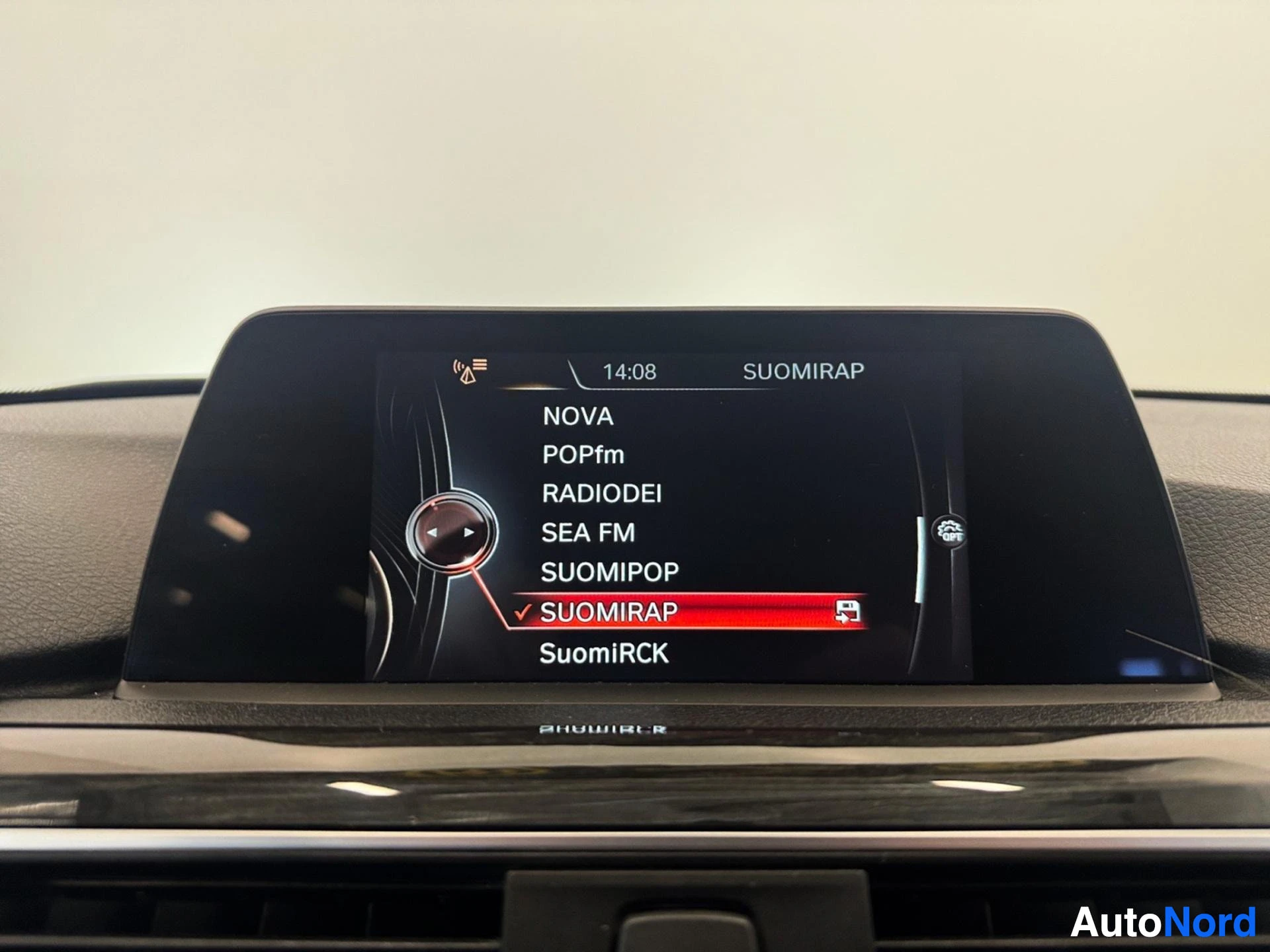Infotainment display showing radio station menu with Finnish stations listed