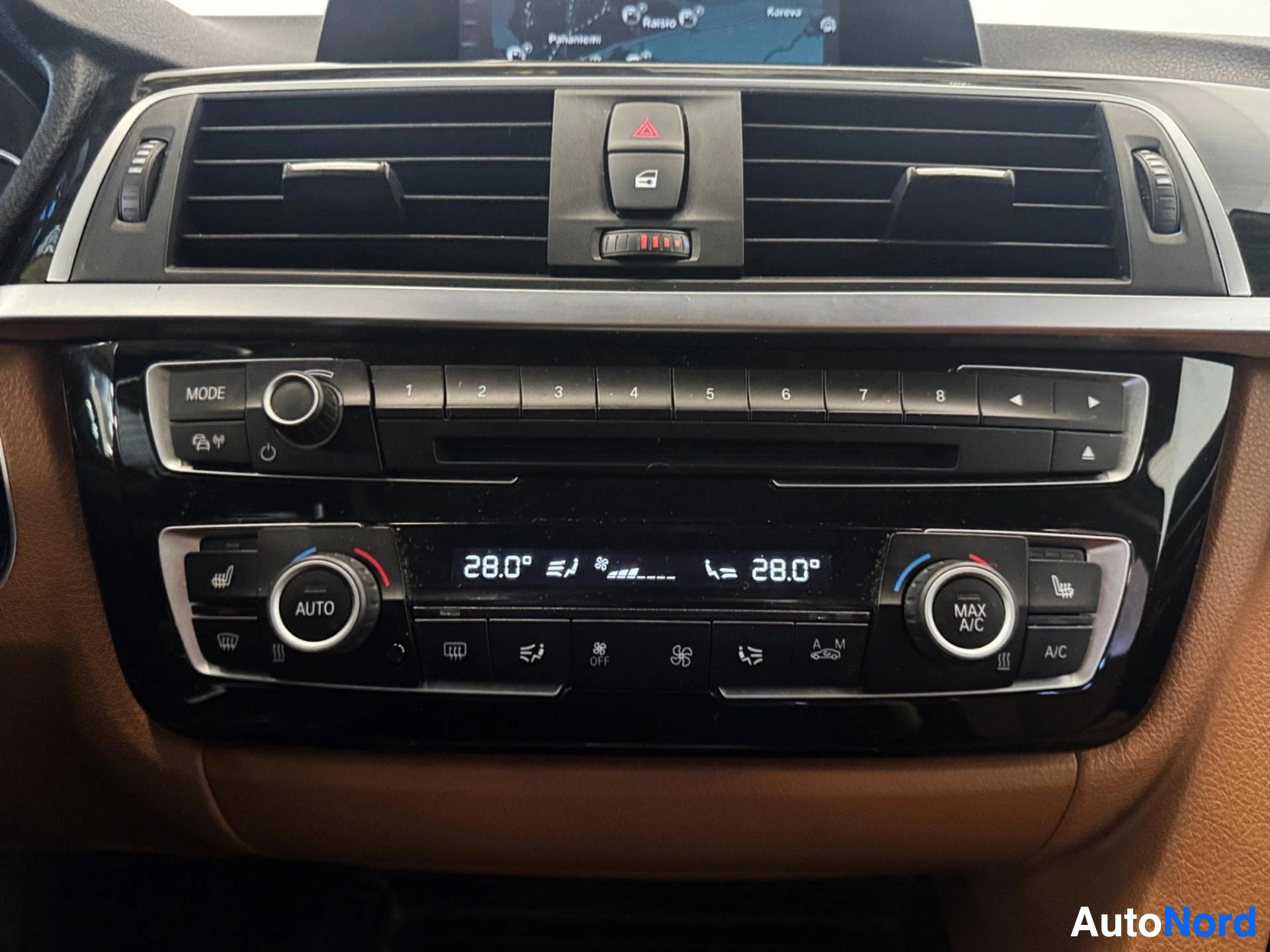 Dashboard center console with climate control and audio system buttons