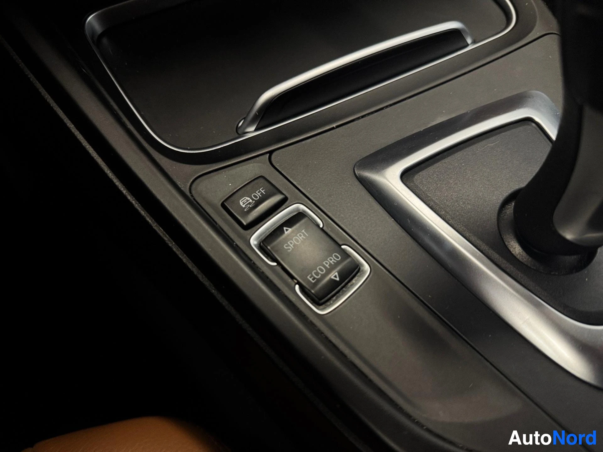 Driver side door panel with ECO PRO and START button controls