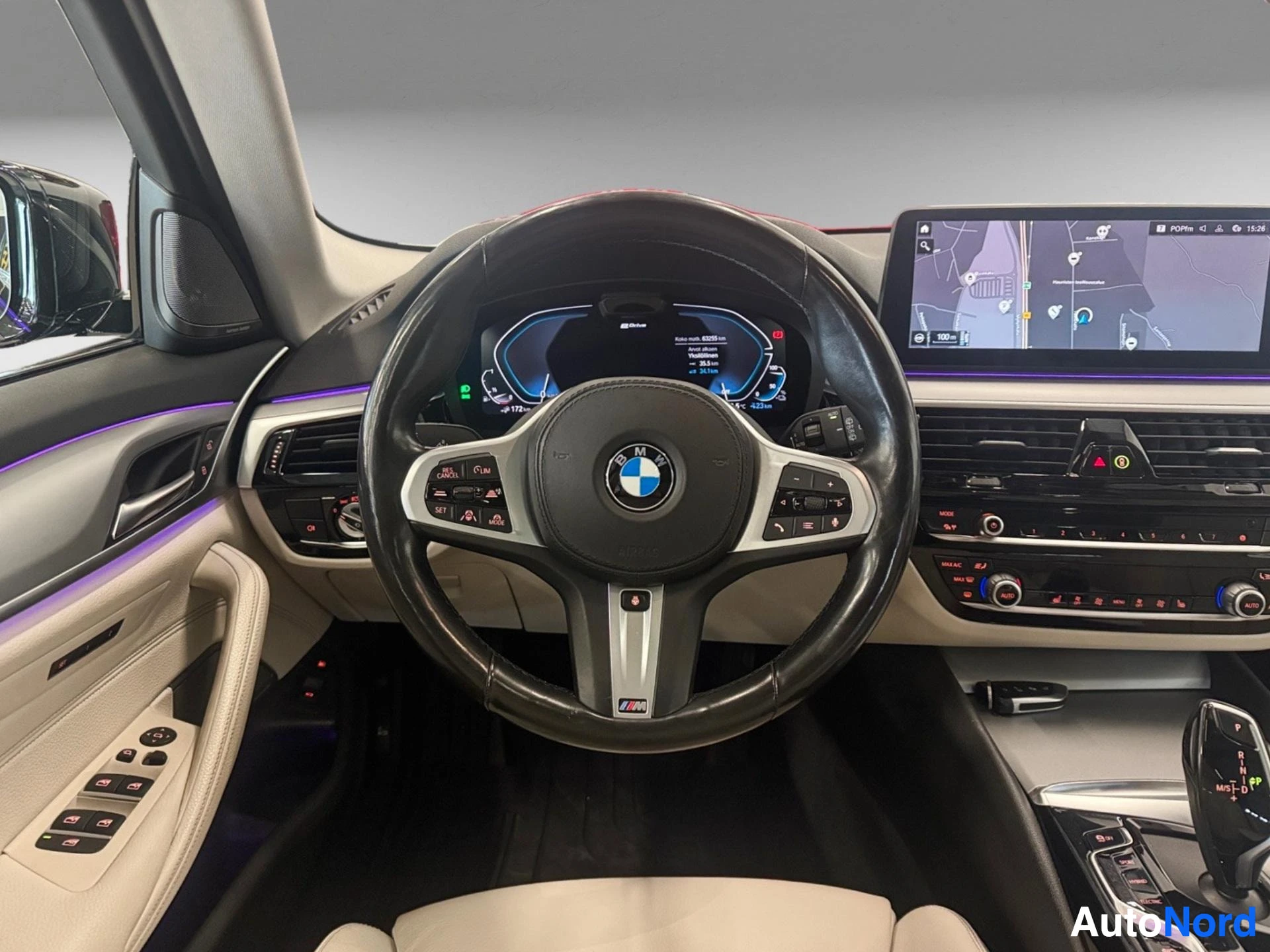Steering wheel and instrument cluster with navigation display visible