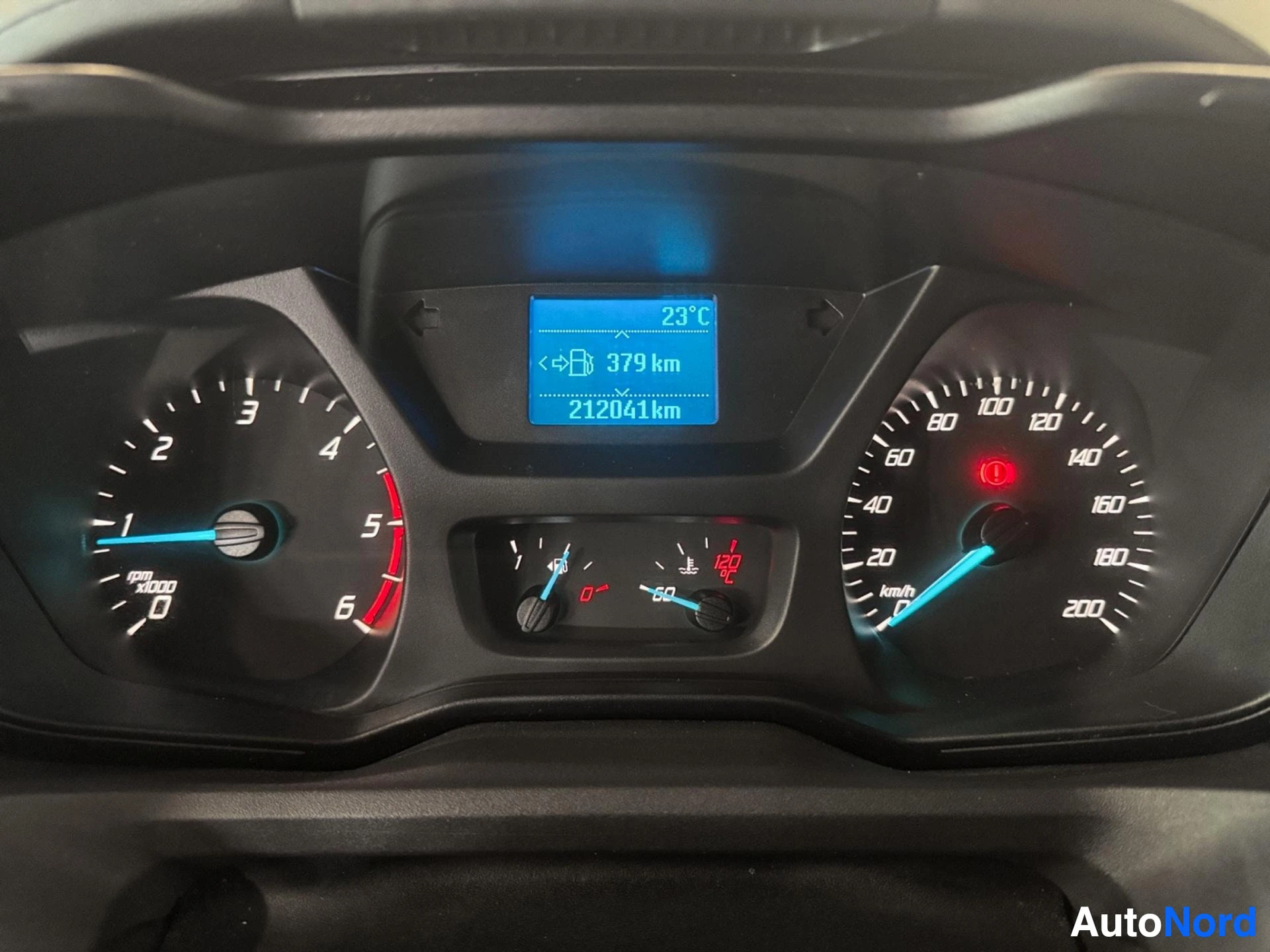 Dashboard instrument cluster showing mileage and temperature display