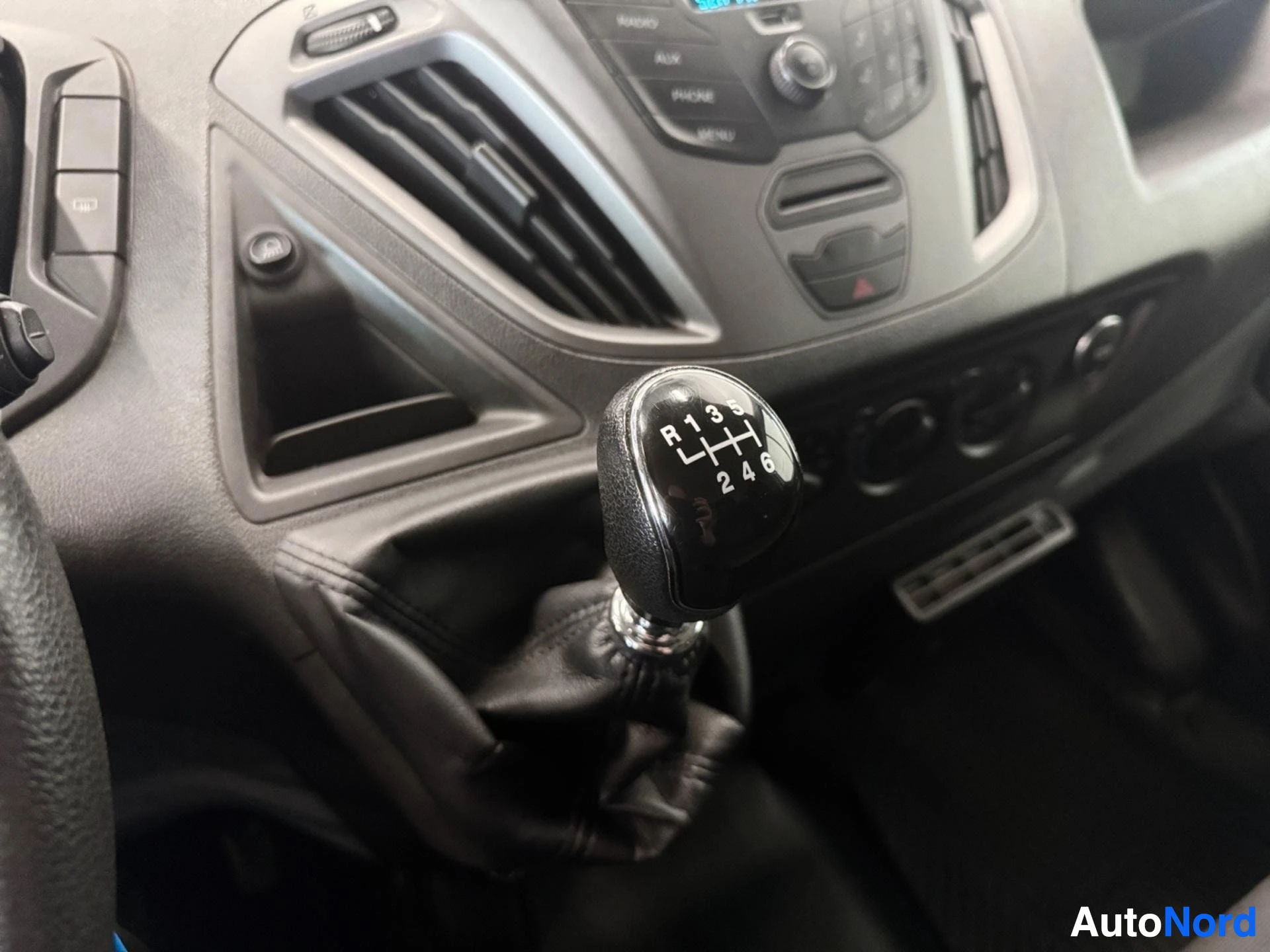 Manual gearshift with six-speed transmission pattern visible