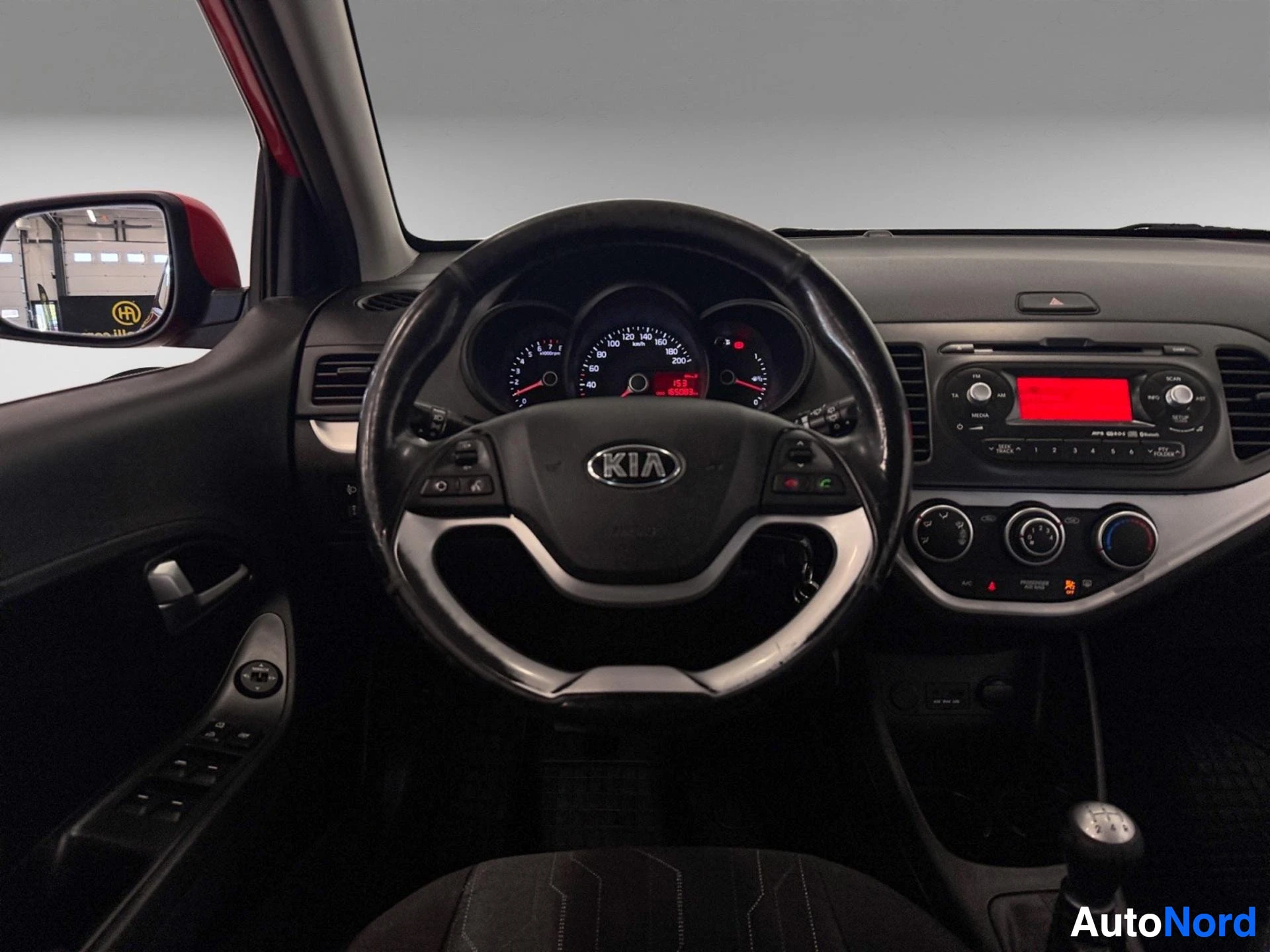 Kia Picanto steering wheel, instrument cluster and dashboard with red display screen