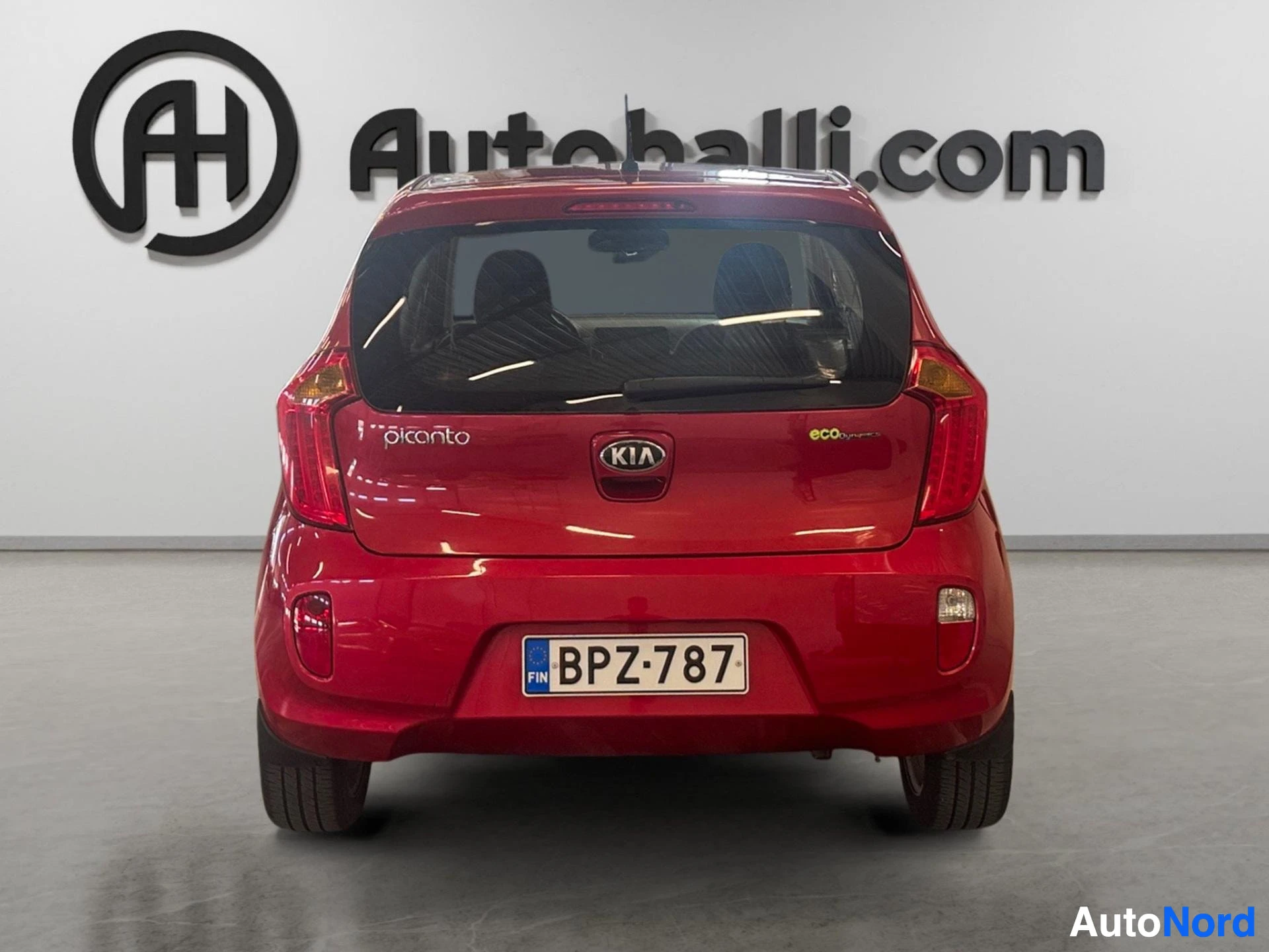 Red Kia Picanto rear view with Picanto and eco badging visible