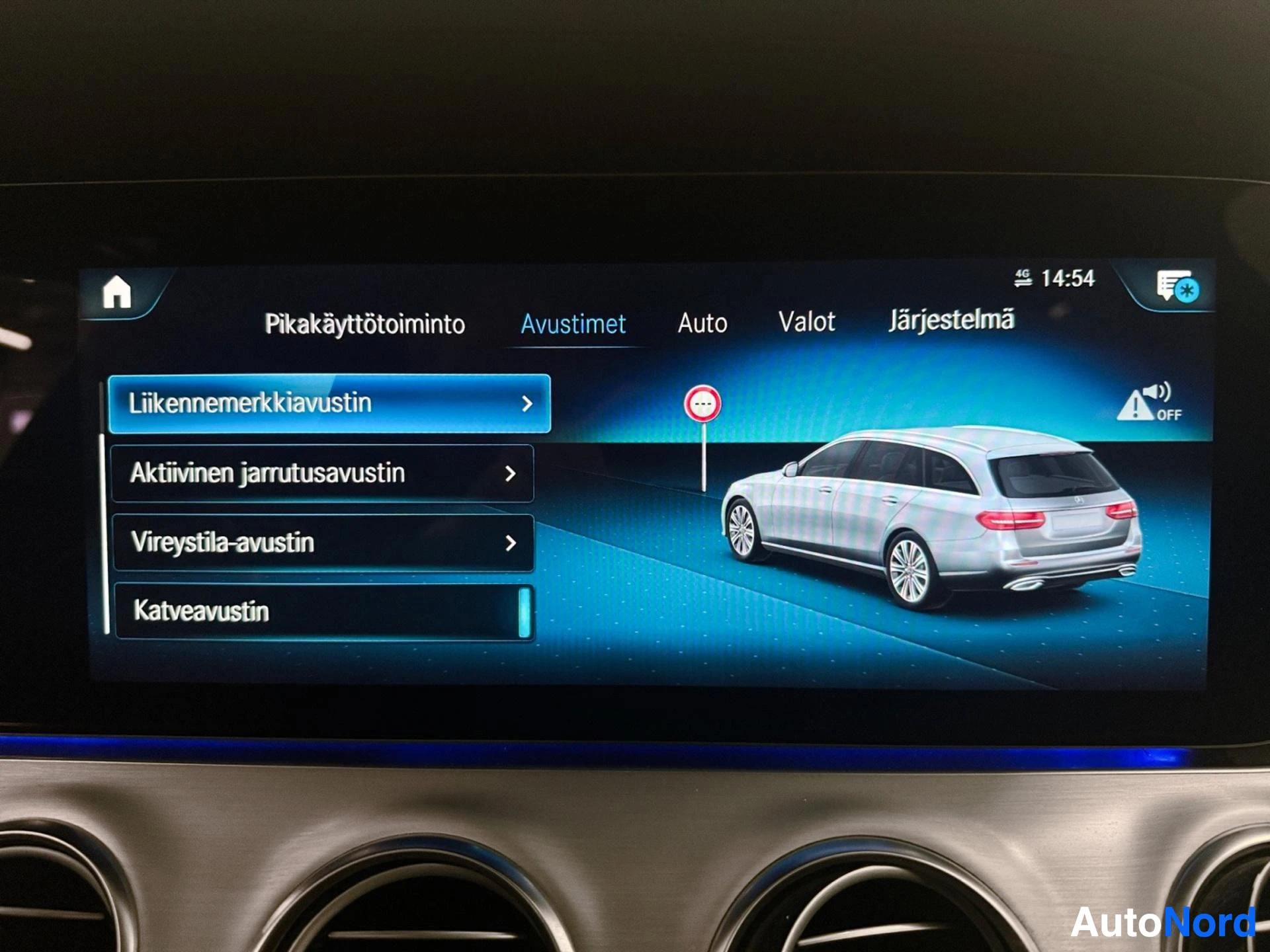 Infotainment display showing vehicle menu with sedan illustration