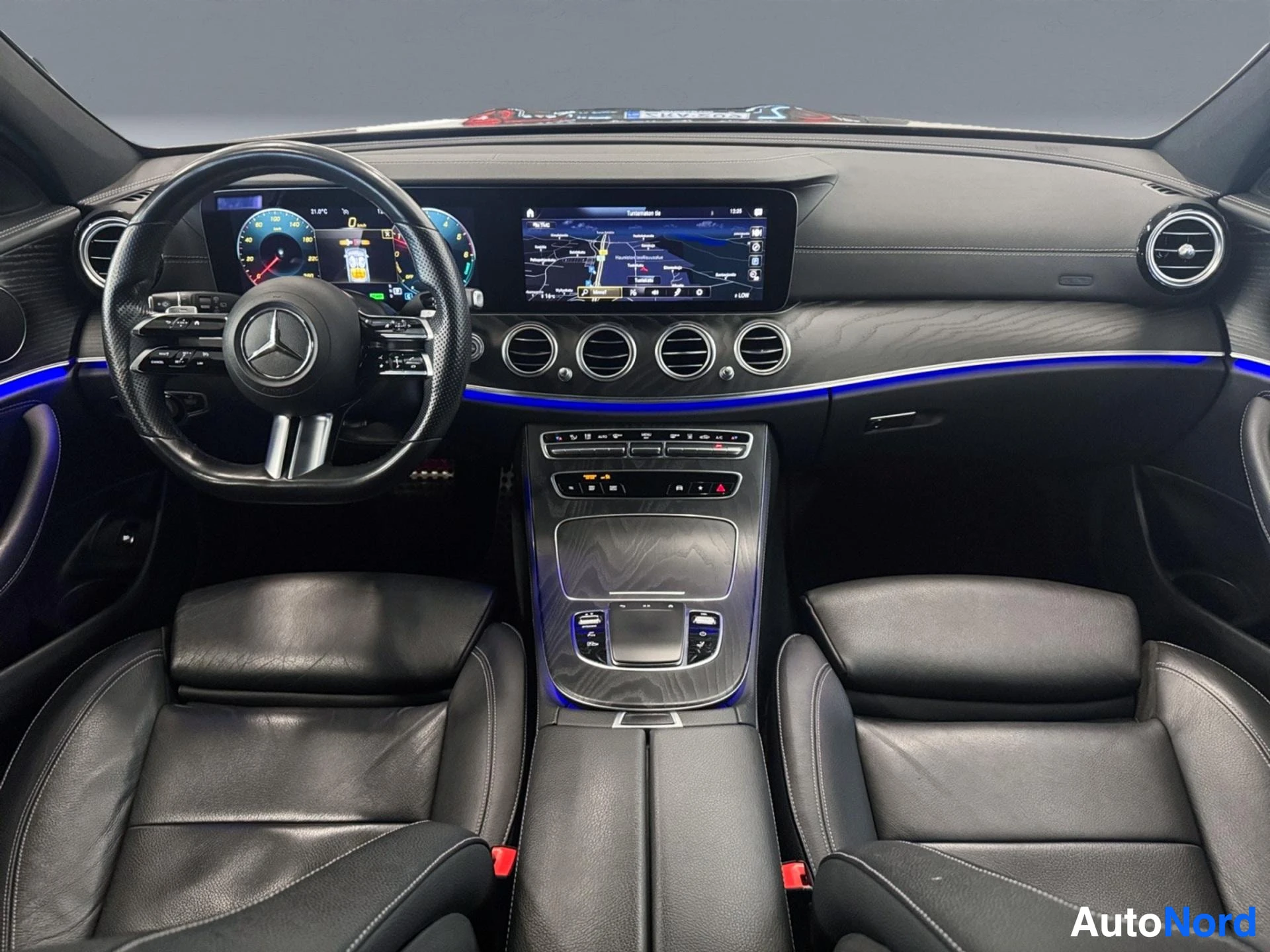 Full interior view of dashboard, seats, and steering wheel from driver position