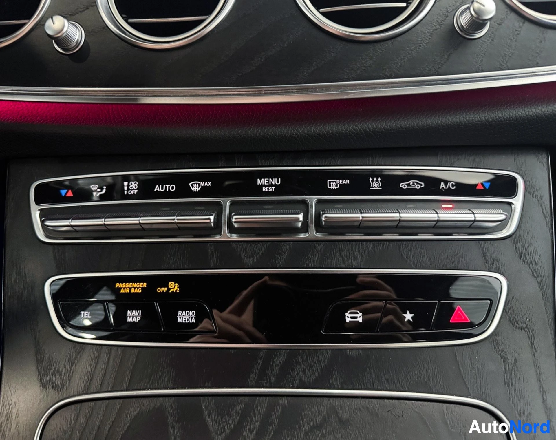 Dashboard control panel with AC, climate, and multimedia function buttons
