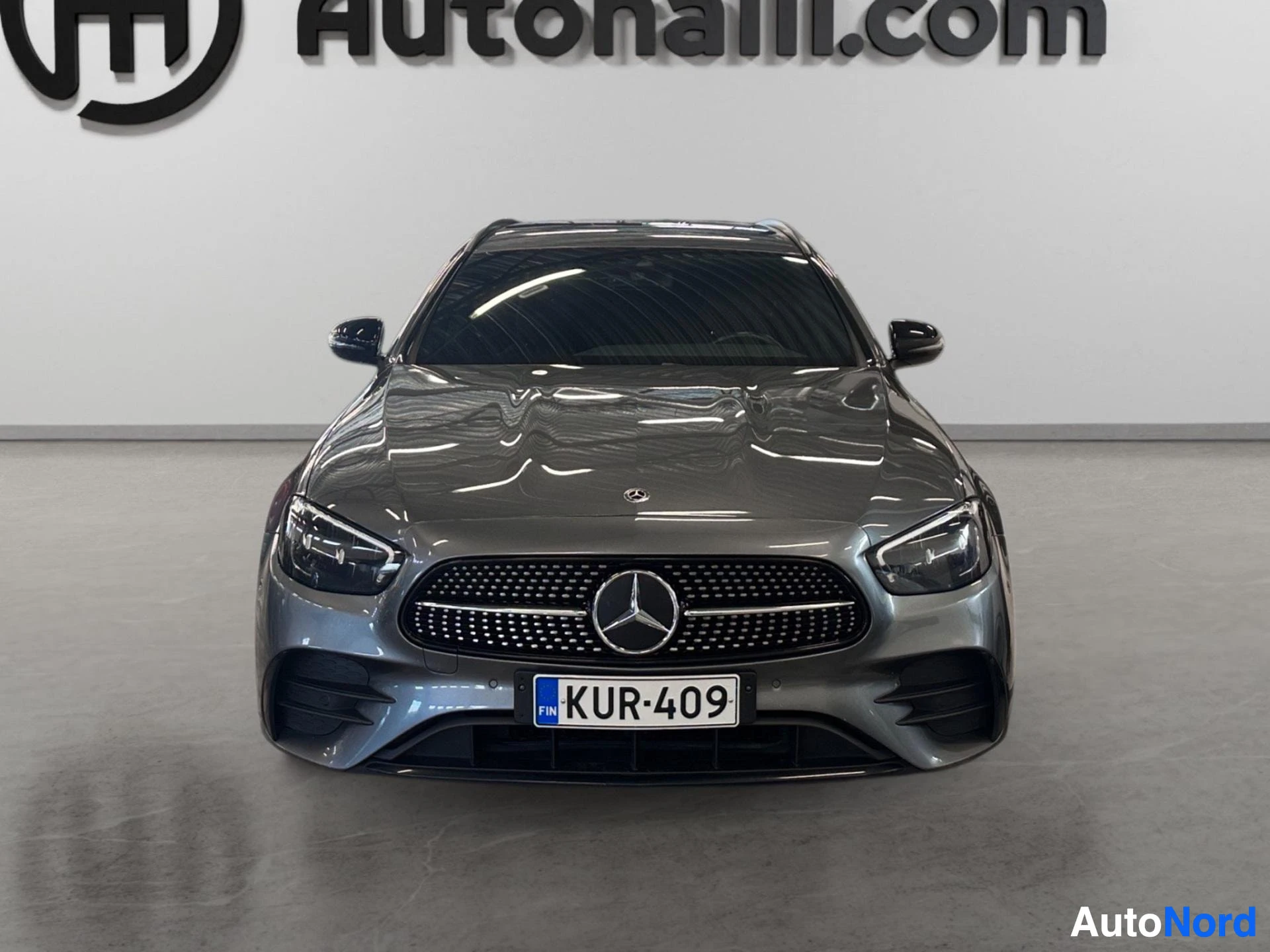 Mercedes-Benz wagon front view showing grille and headlights