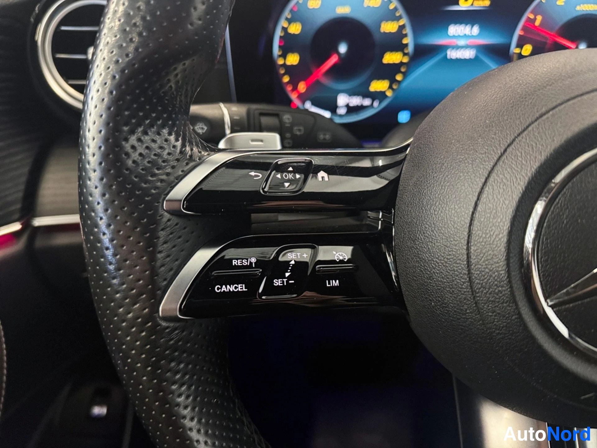 Steering wheel control buttons for cruise control and vehicle functions