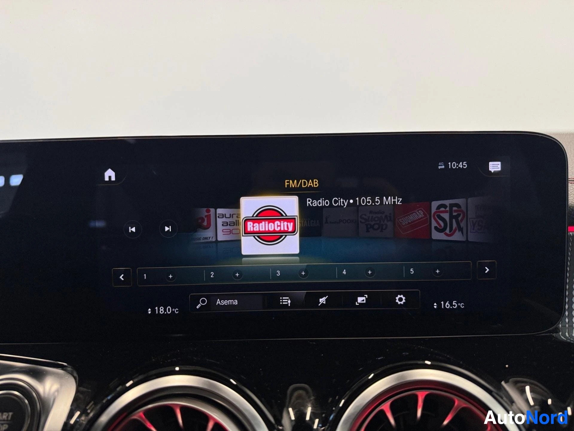 Dashboard infotainment system with FM/DAB radio tuned to Radio City