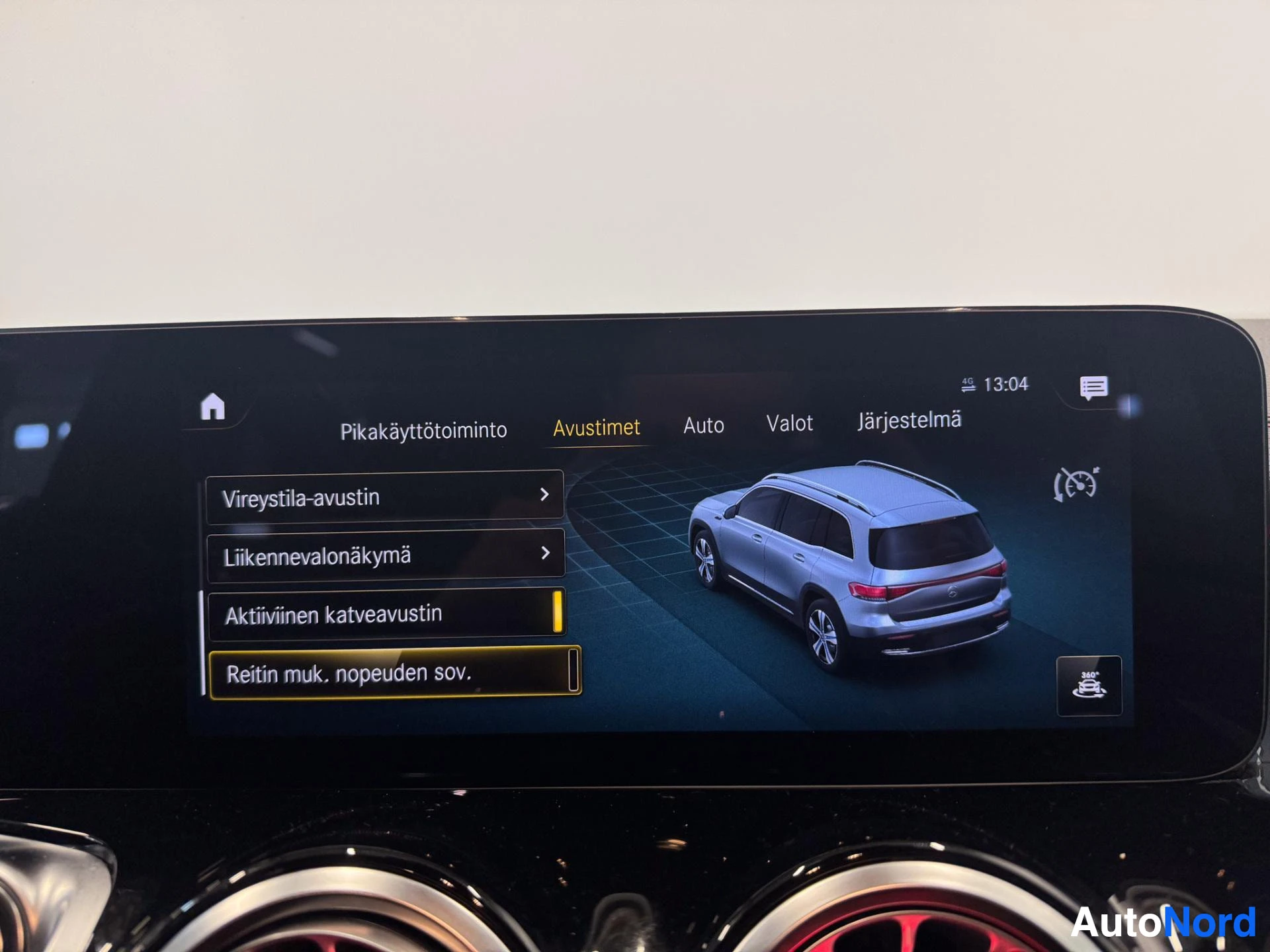Infotainment display showing vehicle overview and menu options