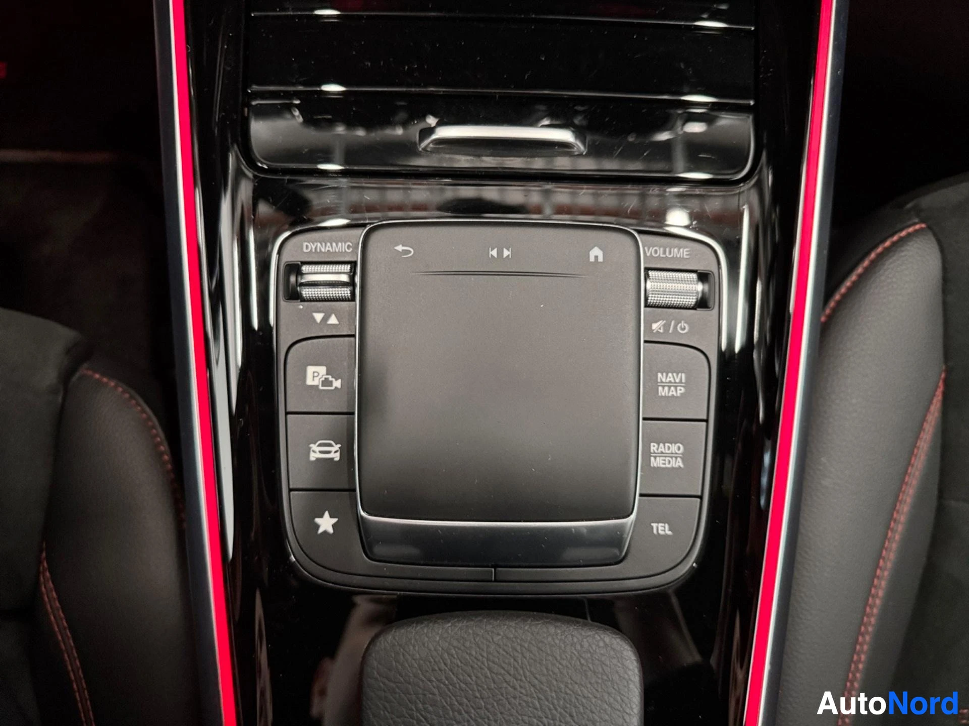 Central control panel with touchpad and menu buttons in black trim