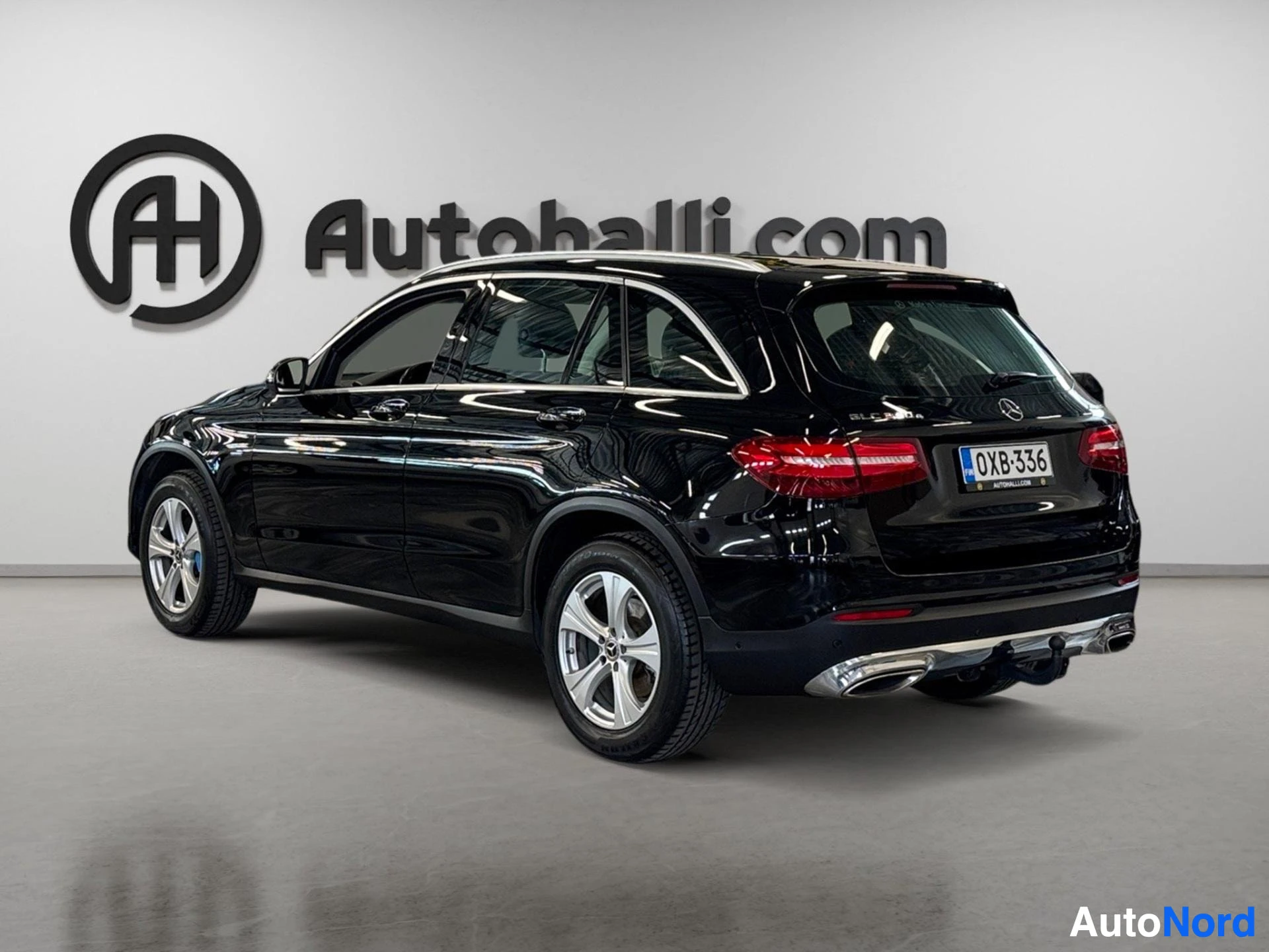 Black Mercedes-Benz SUV rear three-quarter angle with chrome exhaust and alloy wheels