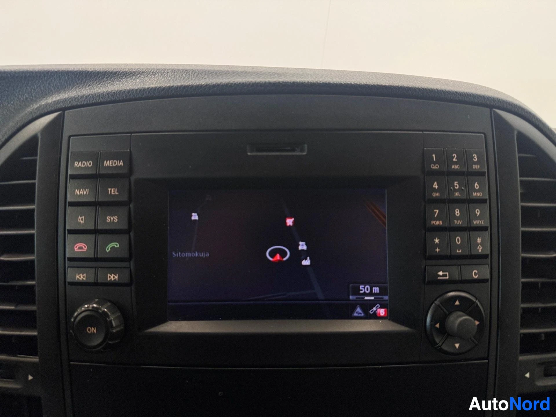 Navigation system display showing map with vehicle location markers