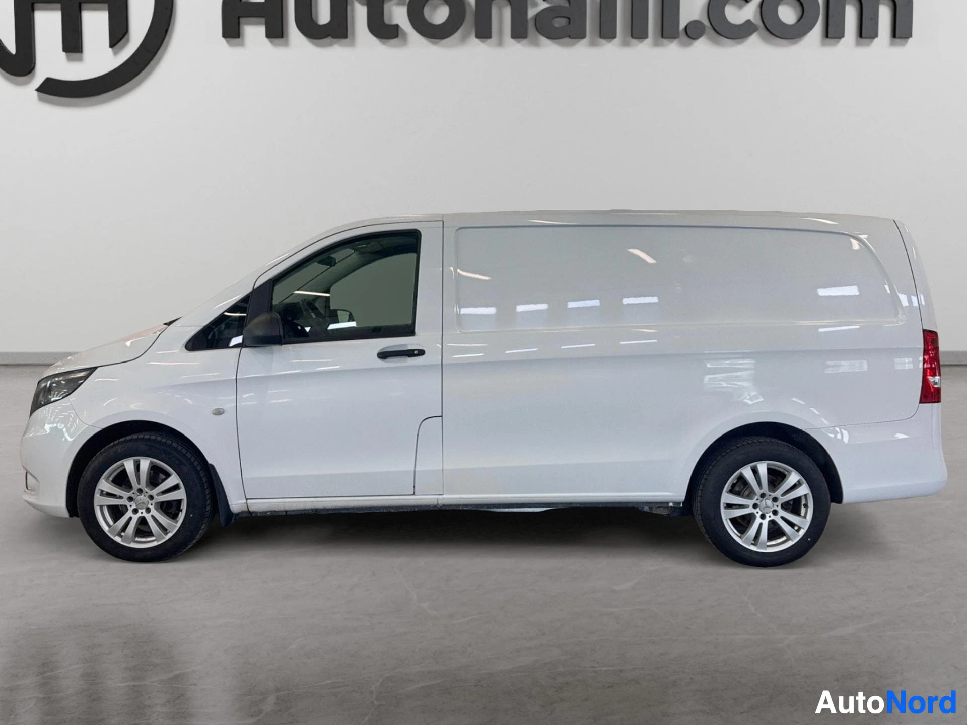 White Mercedes-Benz Vito van profile view with open driver door