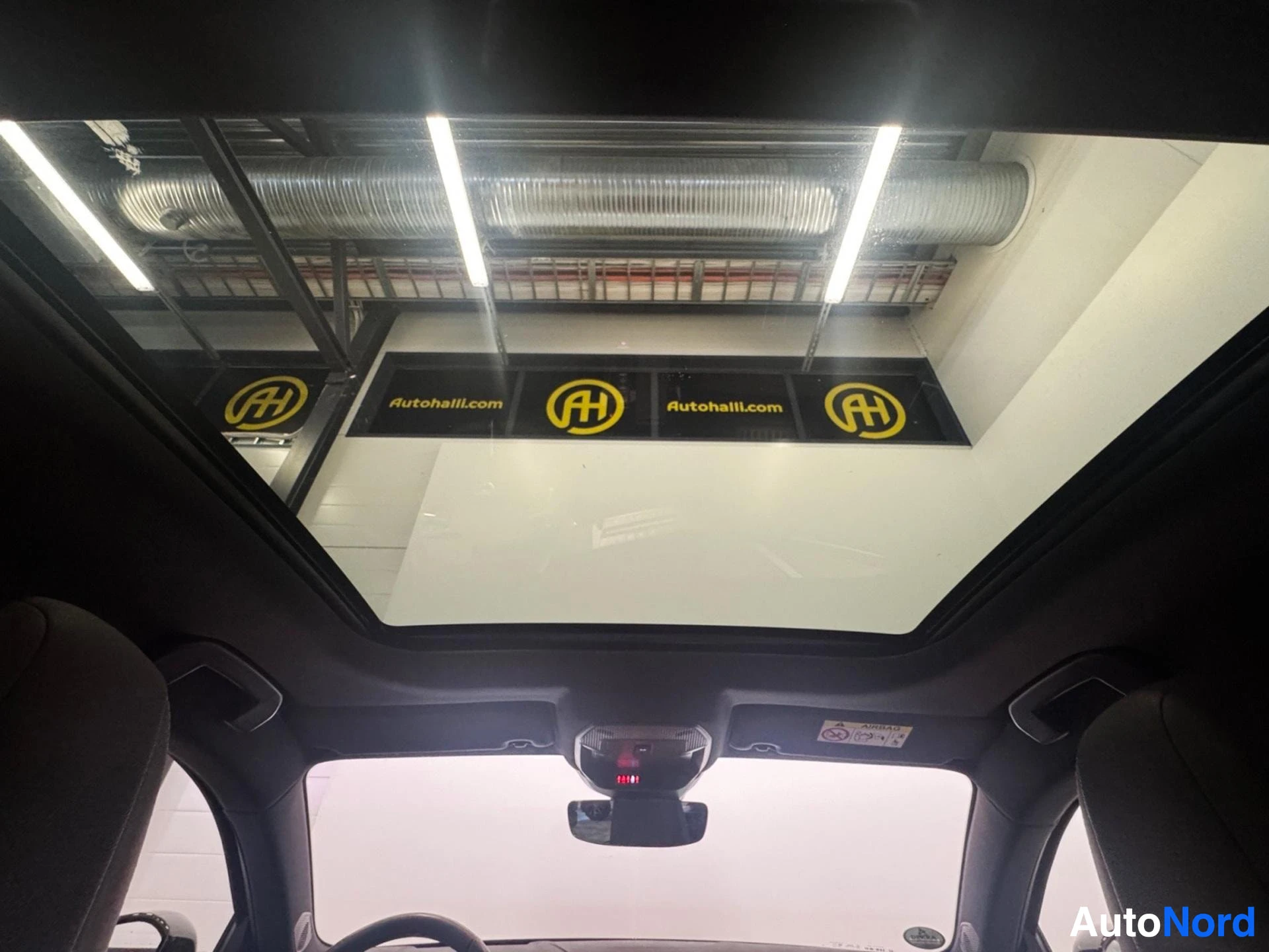 Panoramic sunroof view from interior looking upward
