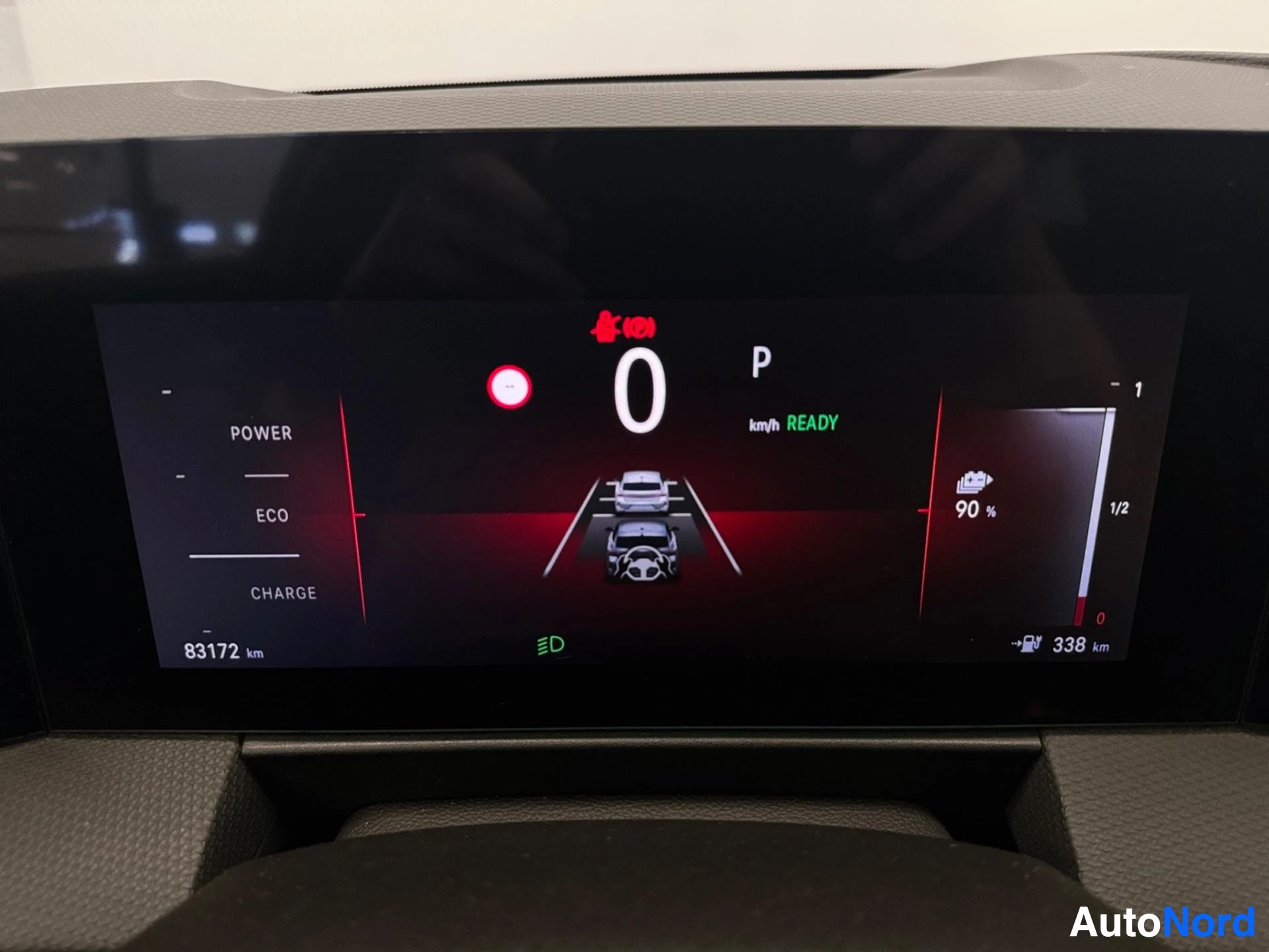 Digital instrument cluster showing speed and battery charge level information