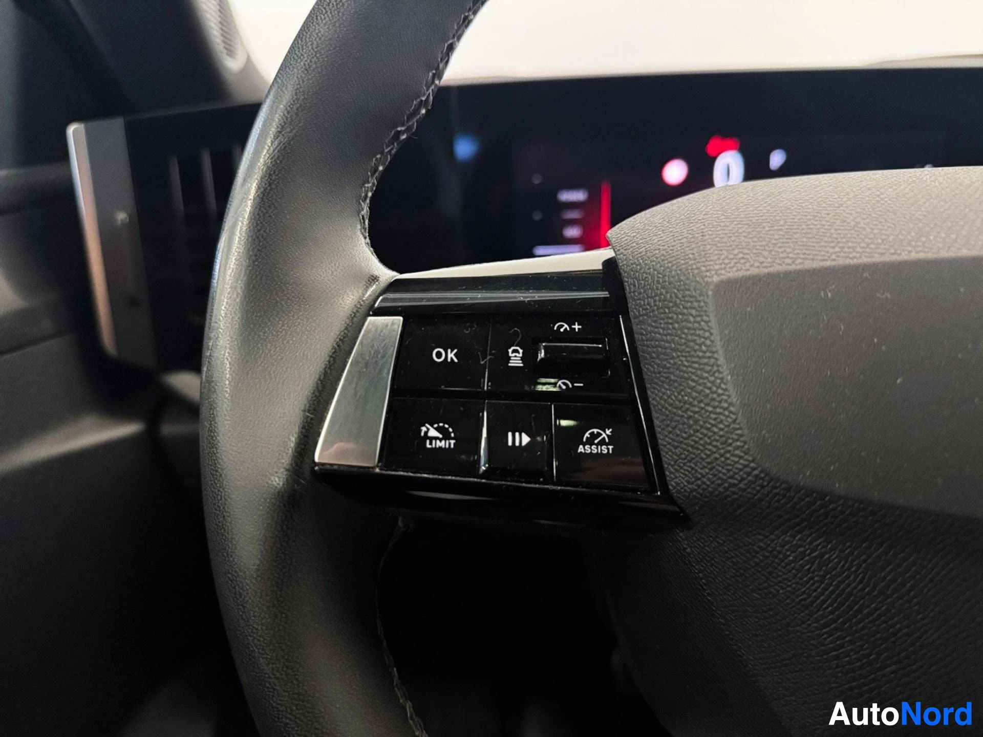 Steering wheel controls including adaptive cruise control assist buttons
