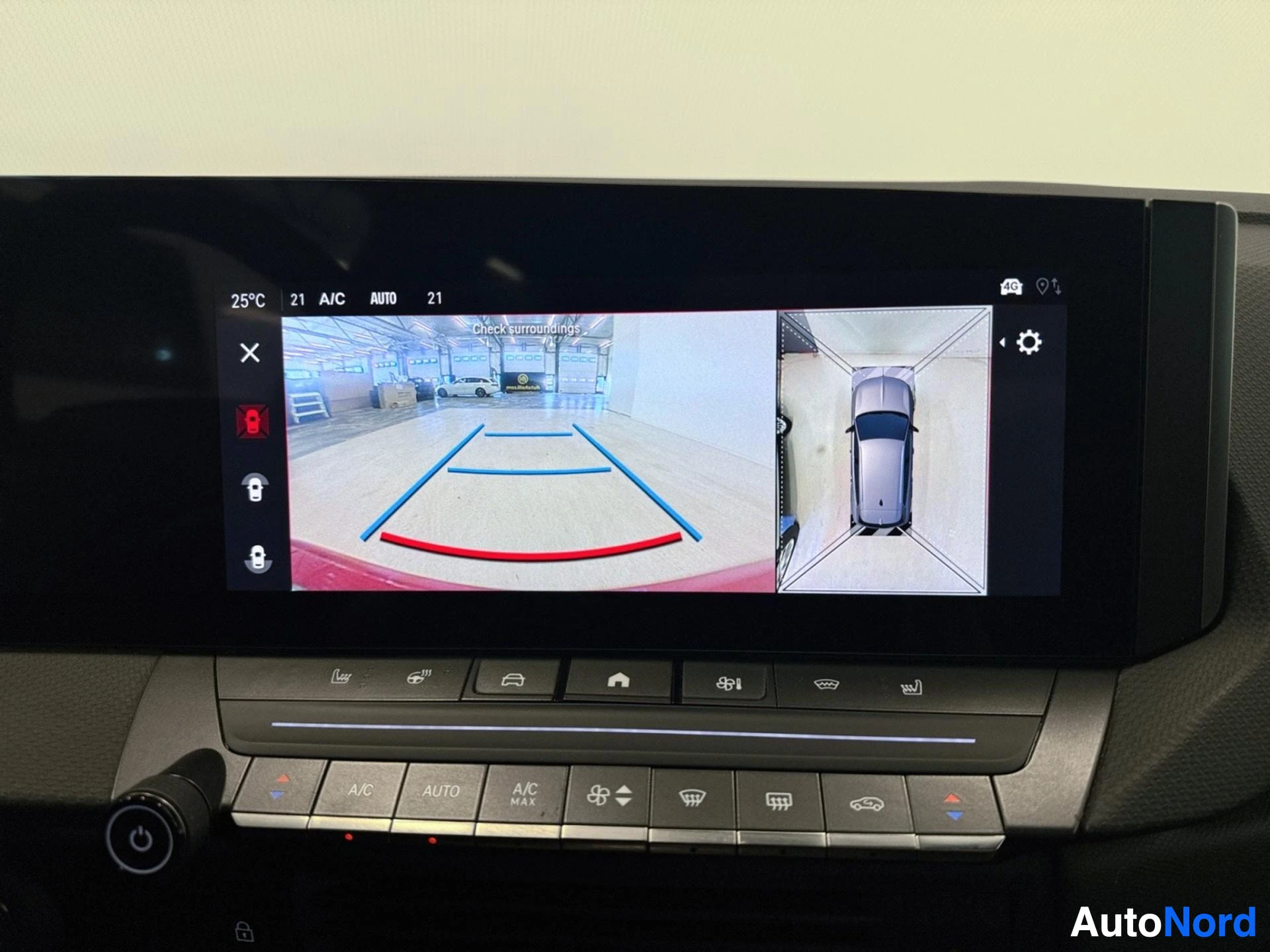 Display showing parking camera view with surrounding camera feed