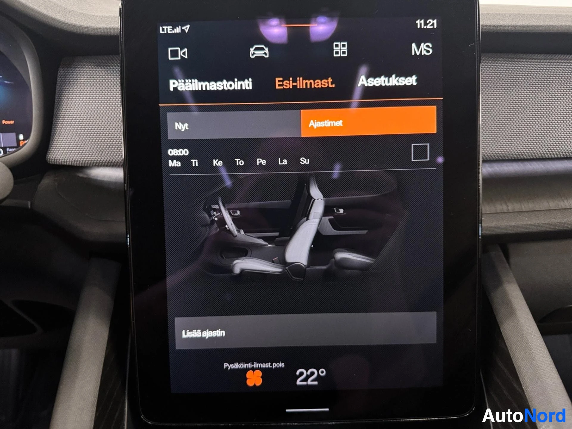 Infotainment screen showing climate control and seat heating settings with interior diagram