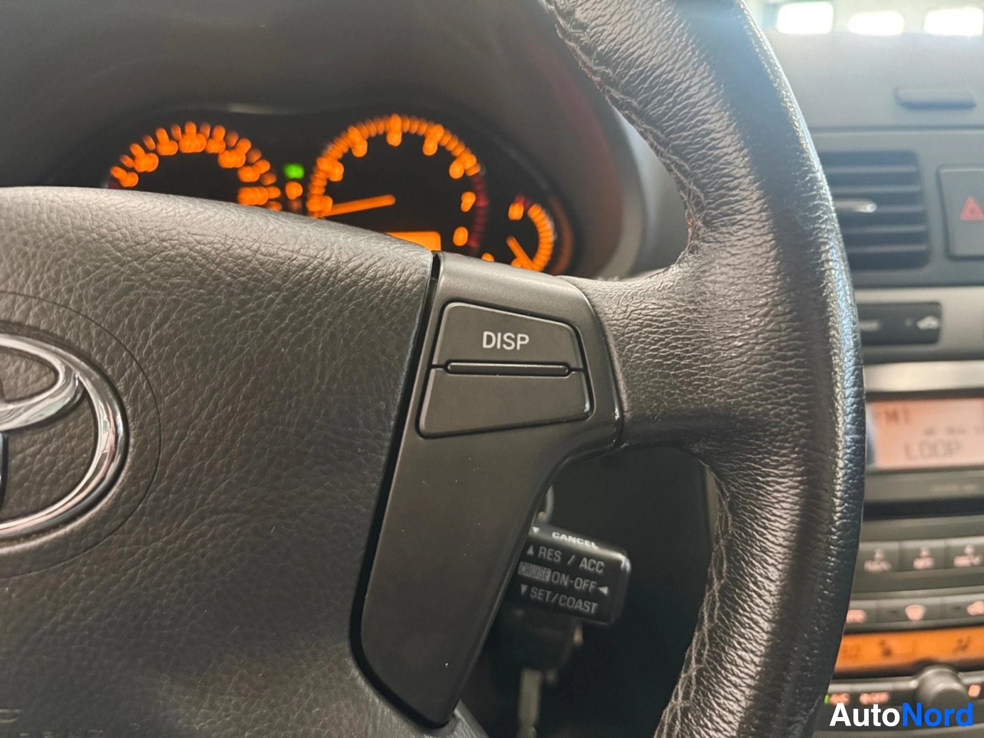 Steering wheel left side controls with DISP button and cruise control functions