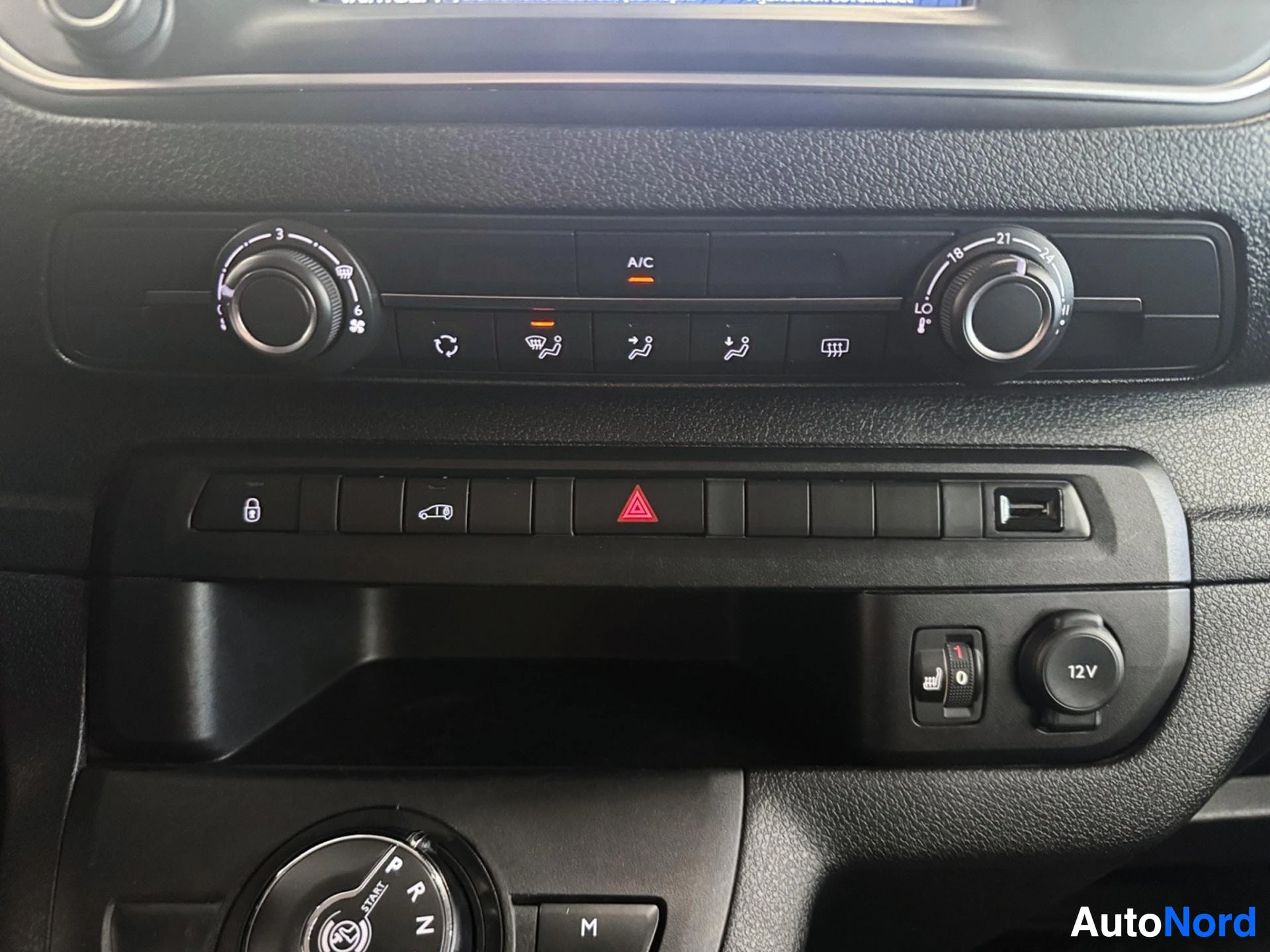 Climate control panel with dual-zone temperature and ventilation buttons