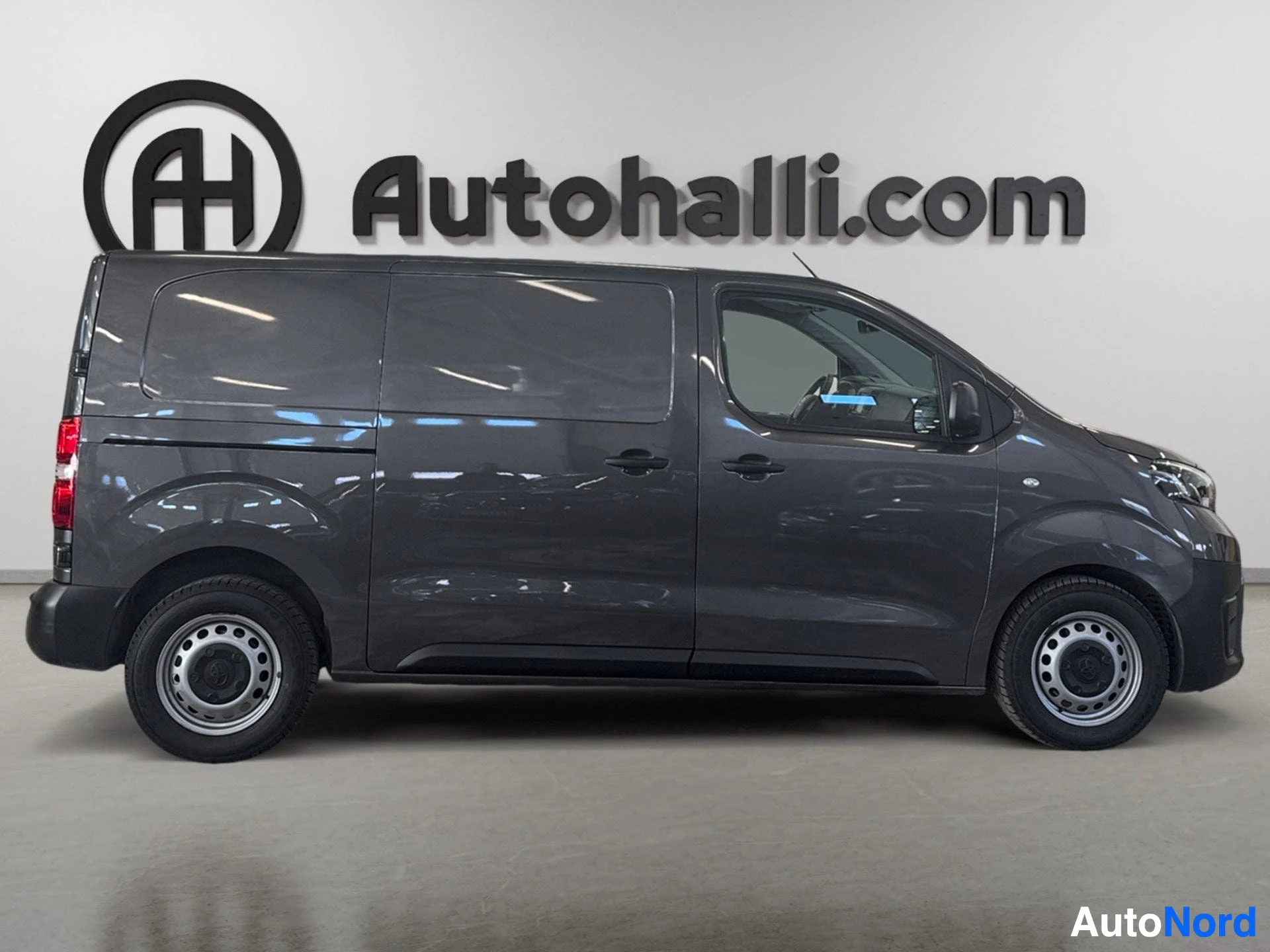 Black Toyota van side profile view showing cargo door and window