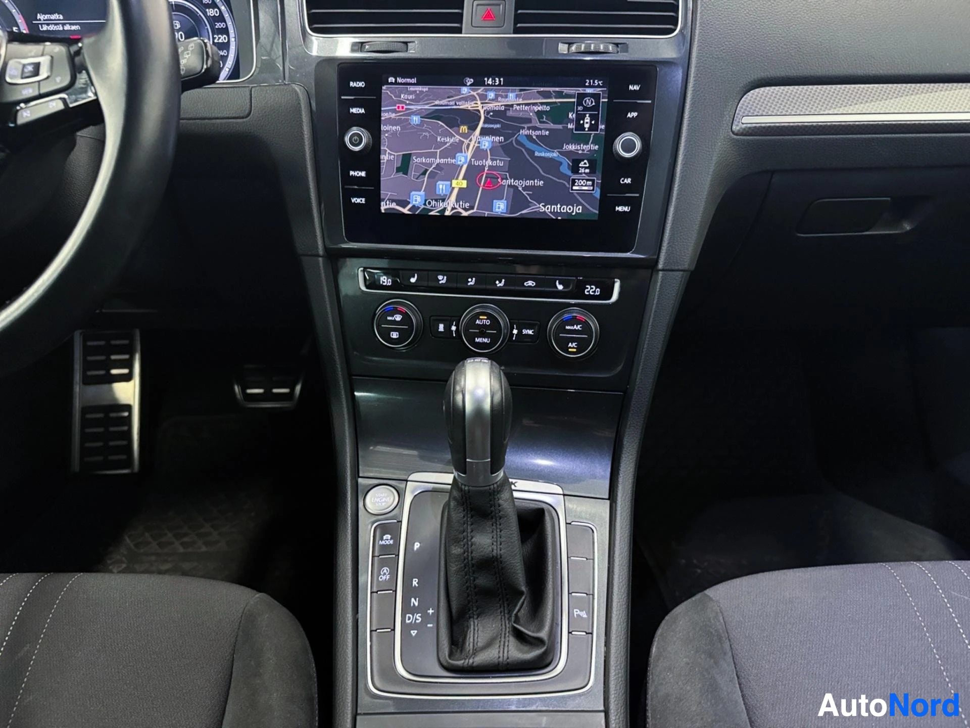 Interior dashboard with infotainment system showing navigation map and climate controls