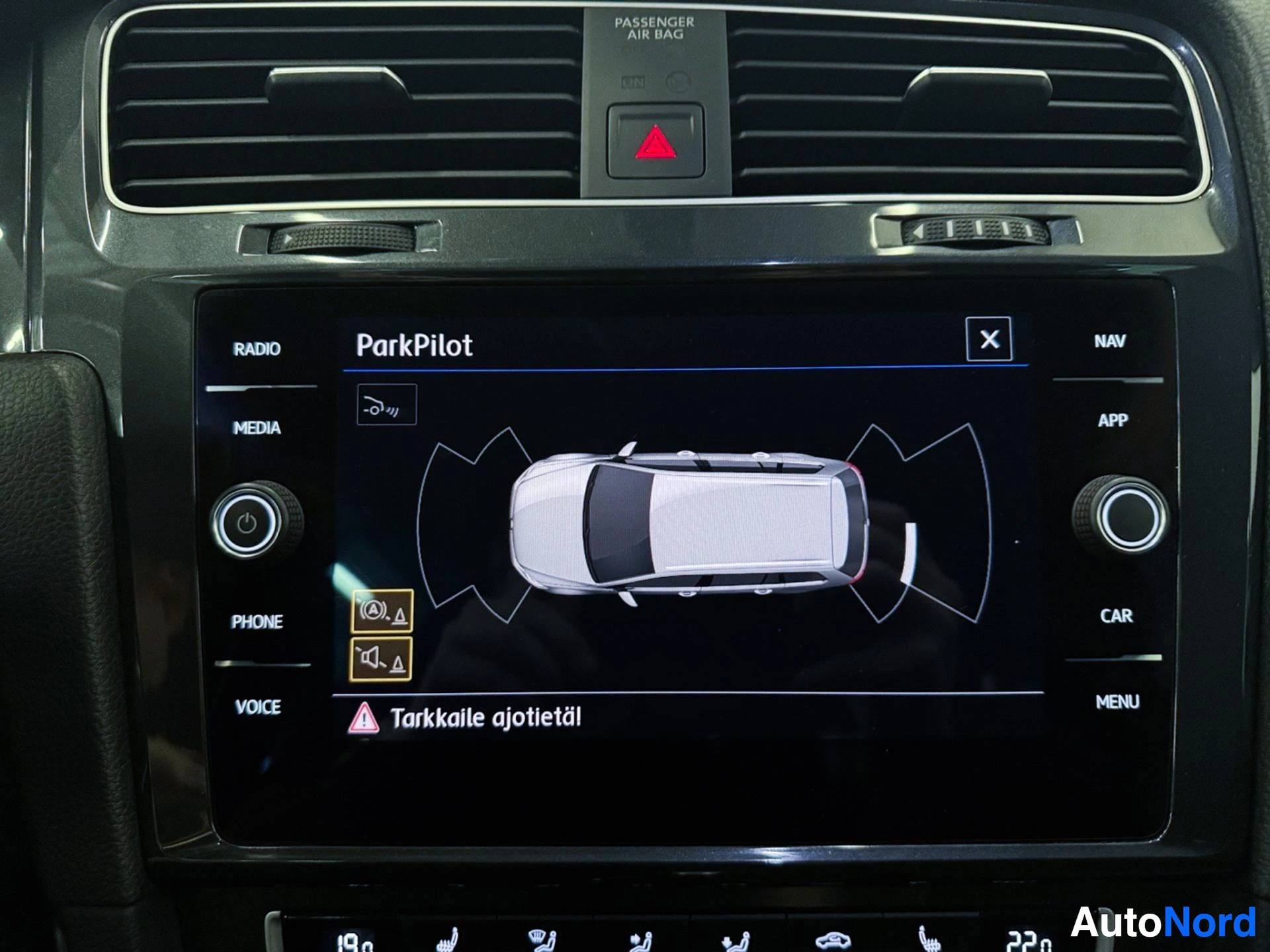 Infotainment display showing ParkPilot parking assistance system with vehicle overhead view