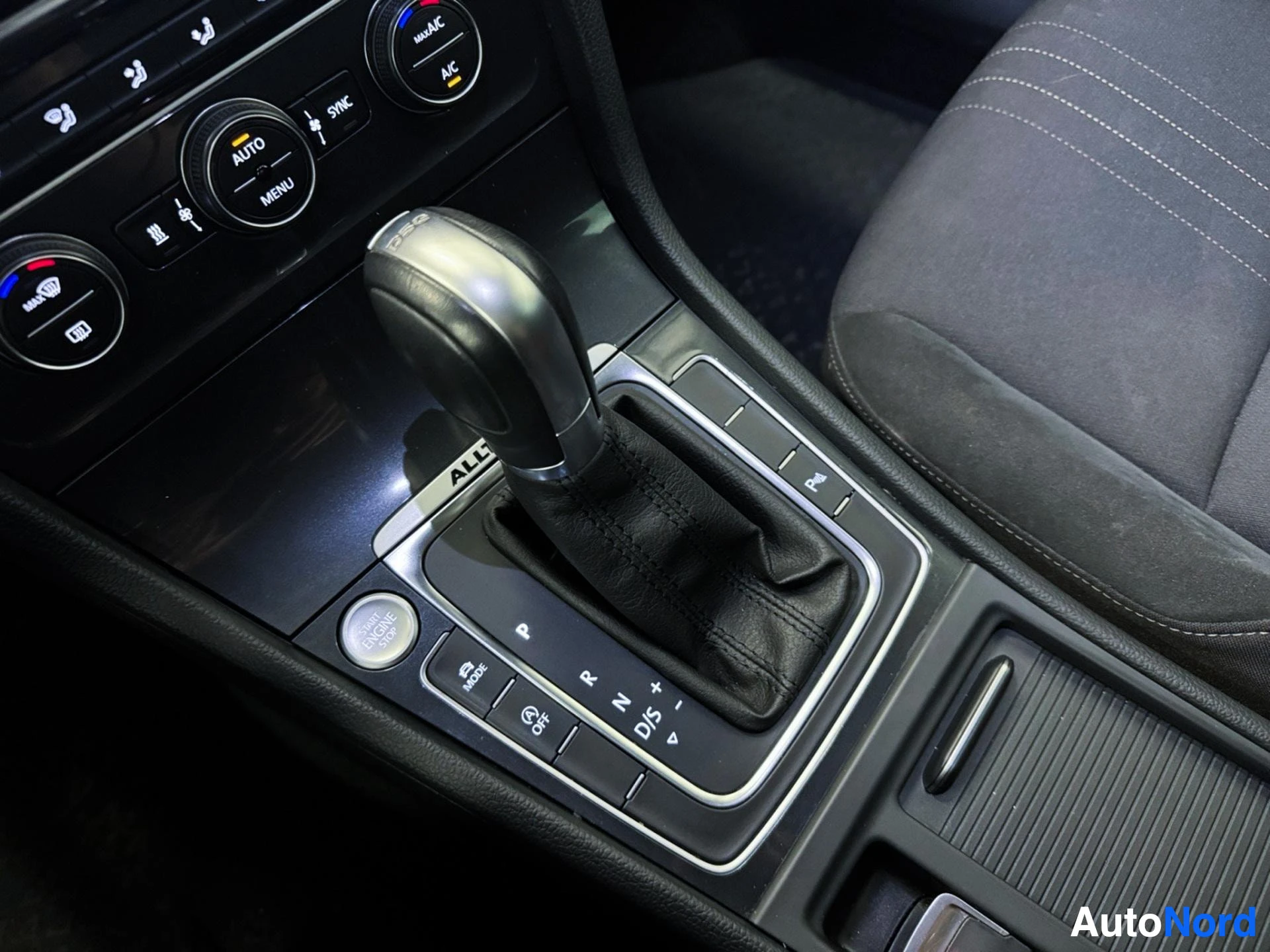 DSG automatic gearshift lever with climate controls and steering wheel visible.