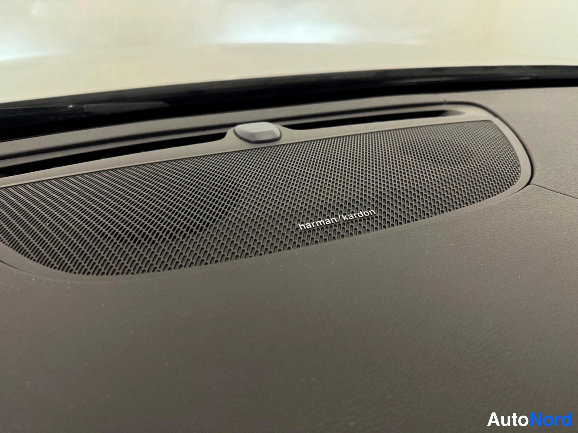 Harman Kardon premium audio speaker grille on dashboard