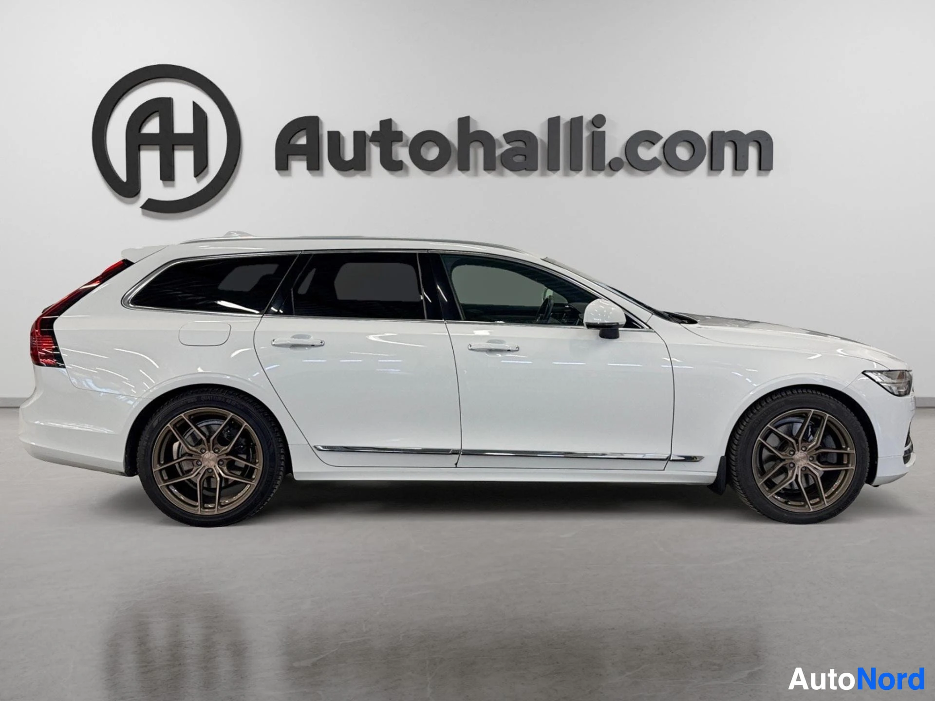 White Volvo V90 wagon profile view from left side