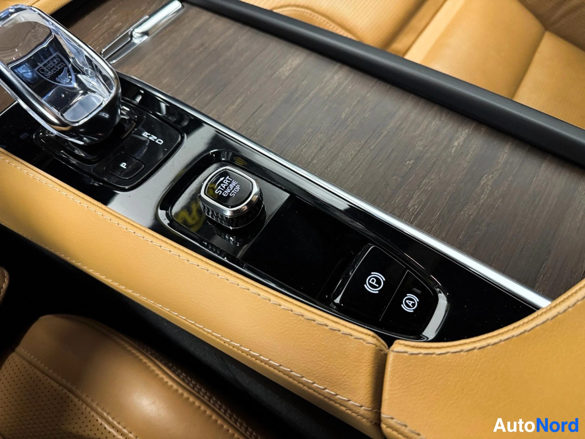 Console control buttons including gear selector and parking assistance functions