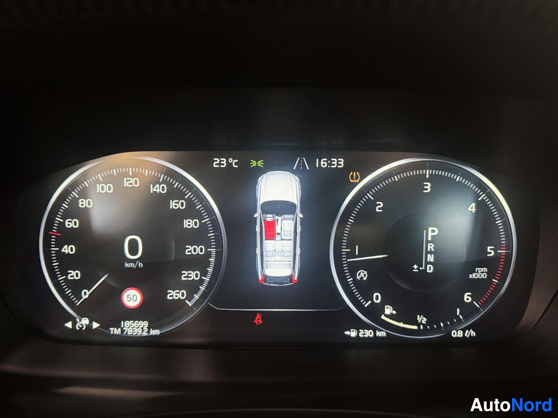Digital instrument cluster showing speedometer at 0 km/h and temperature display