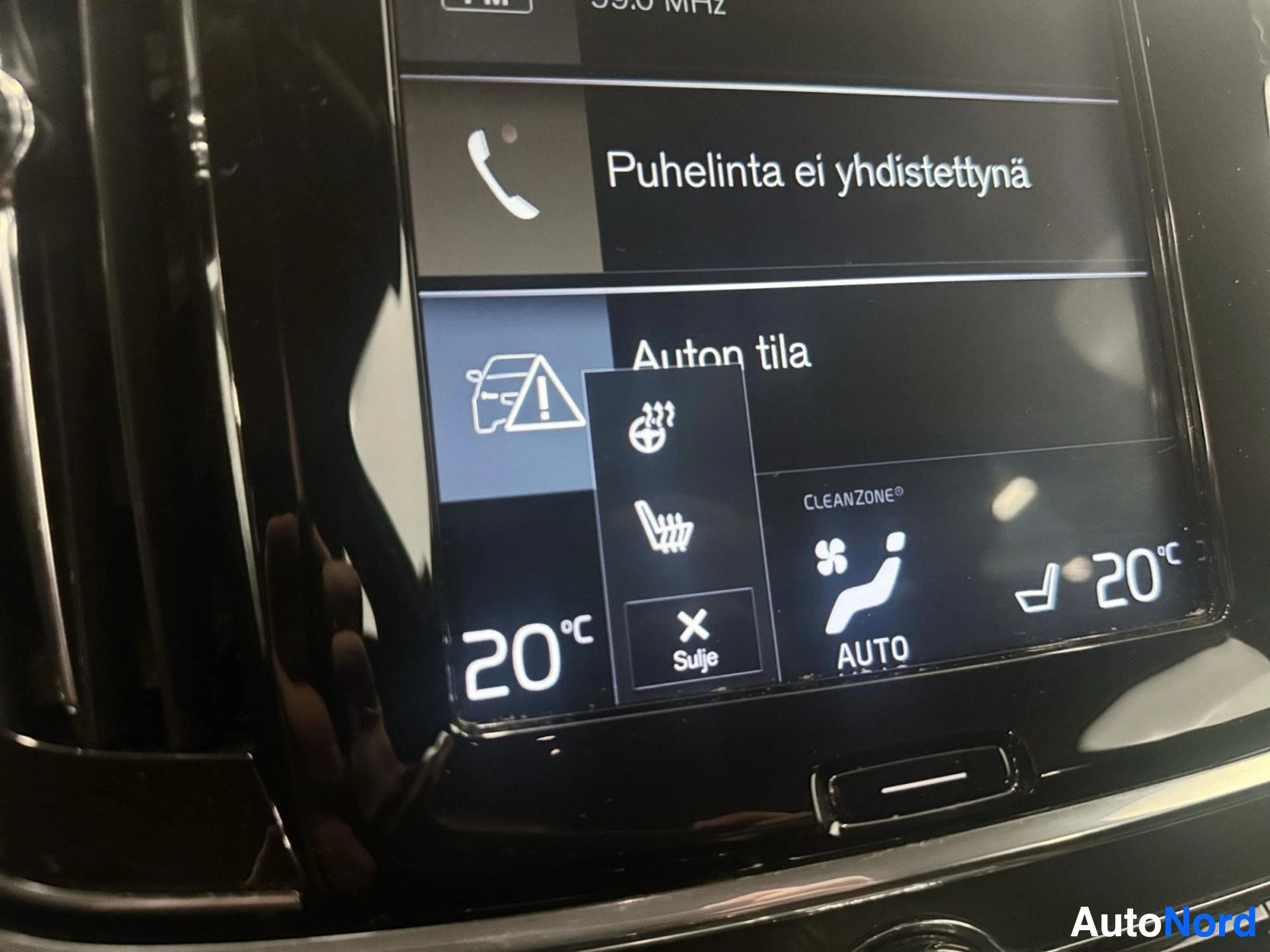 Center console display showing call functions and seat heating controls.