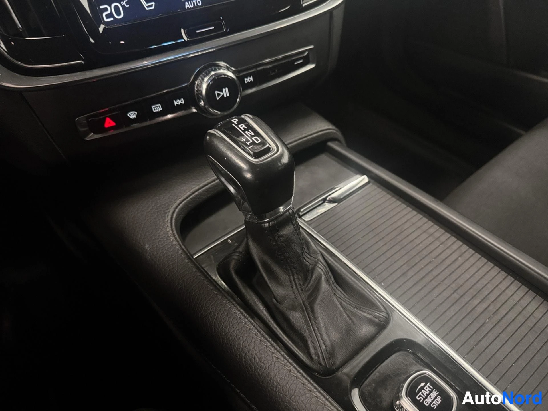 Automatic transmission gear shift lever and climate controls in center console.