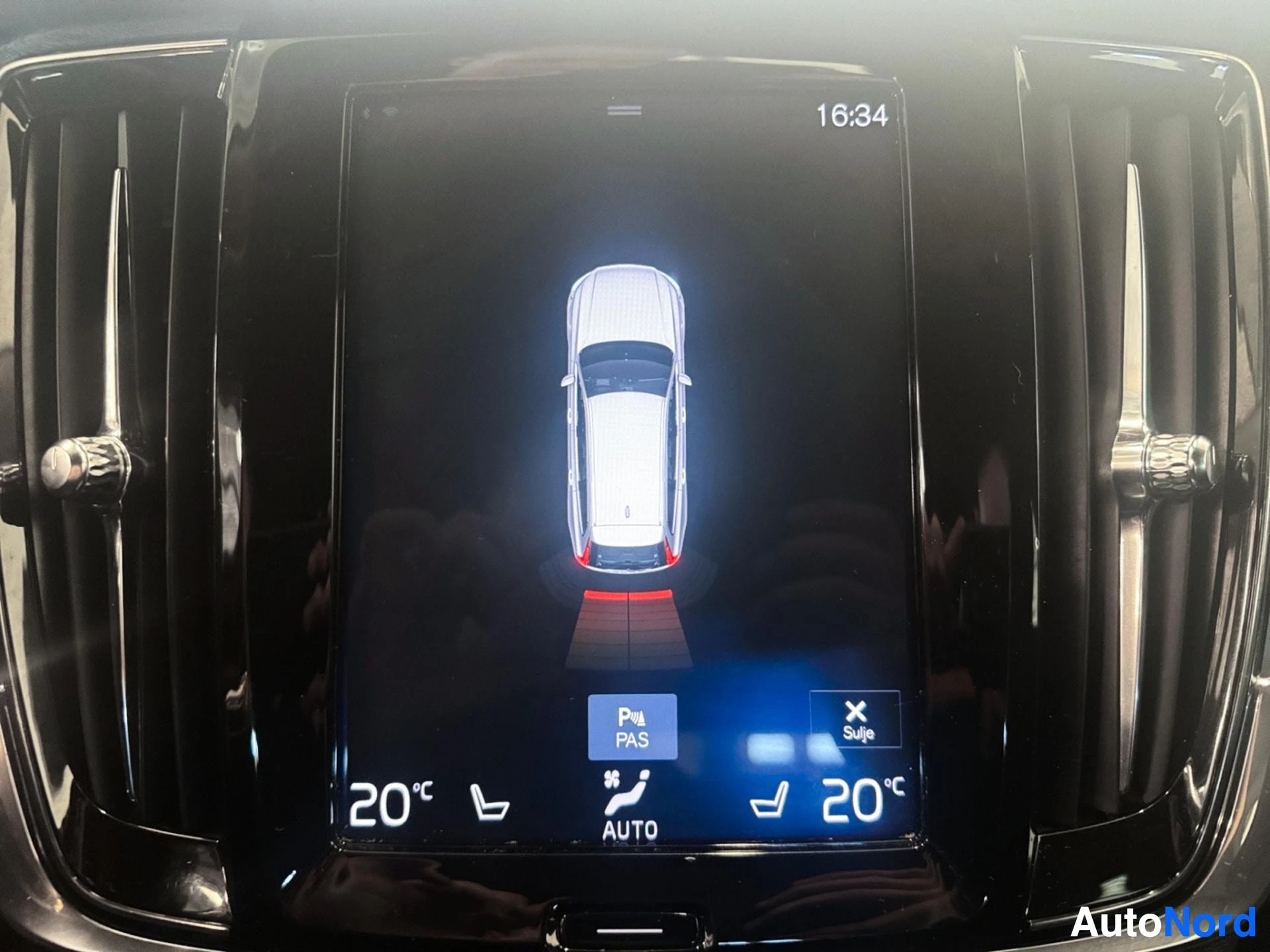 Center display showing 360-degree parking camera view of vehicle from above
