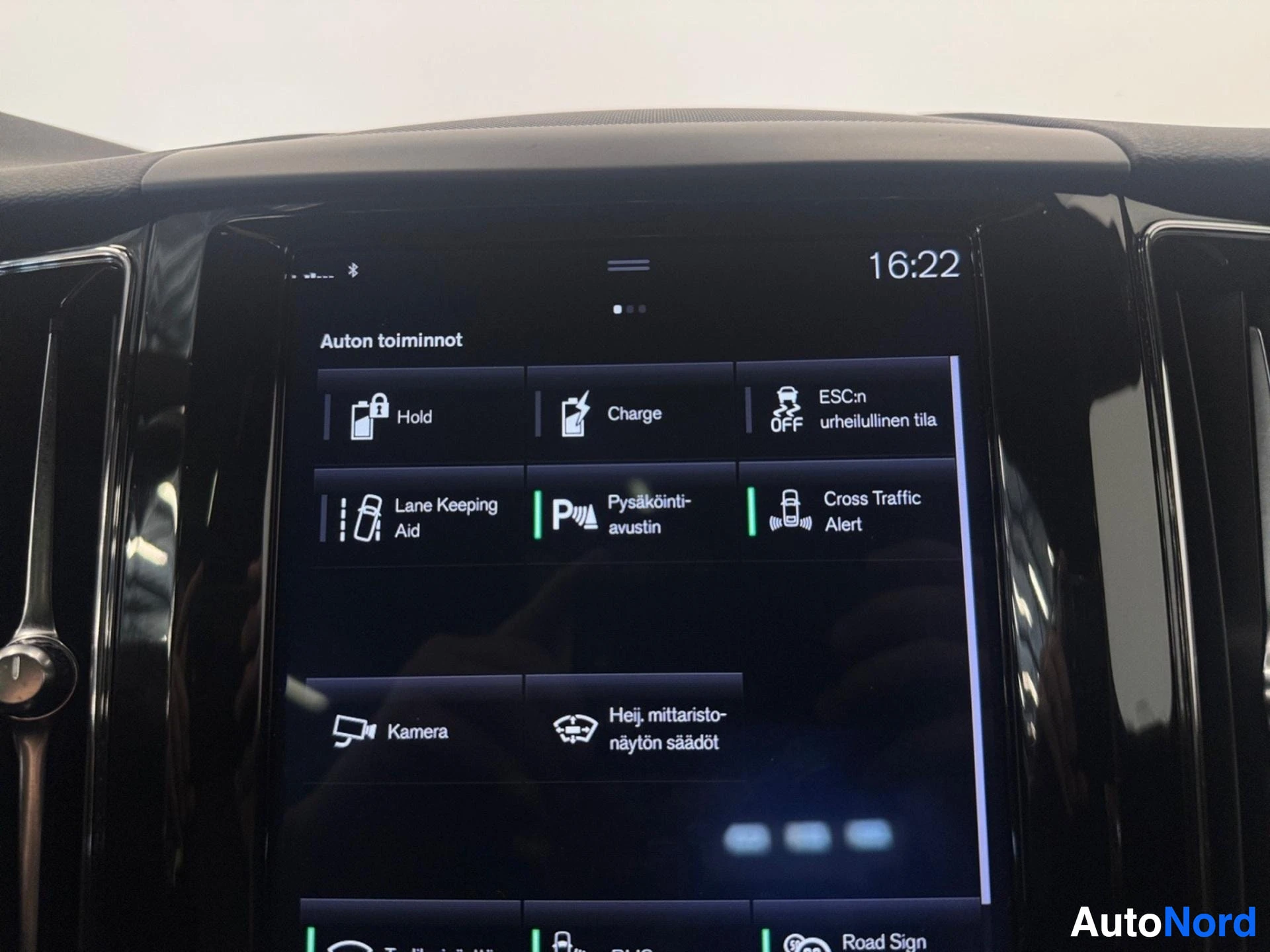 Infotainment screen showing vehicle functions and safety features menu