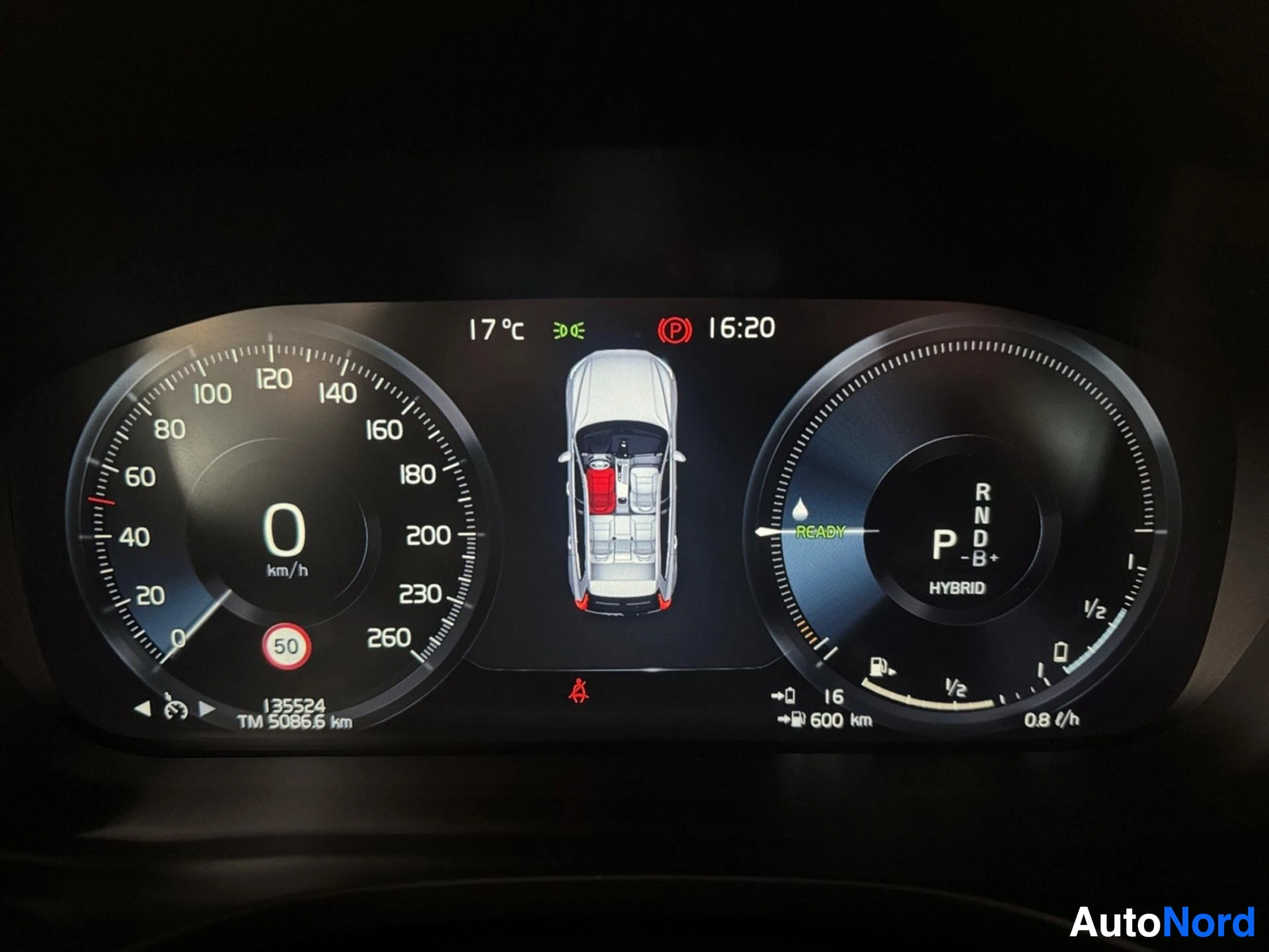 Digital instrument cluster showing hybrid system, speedometer, and vehicle status display.