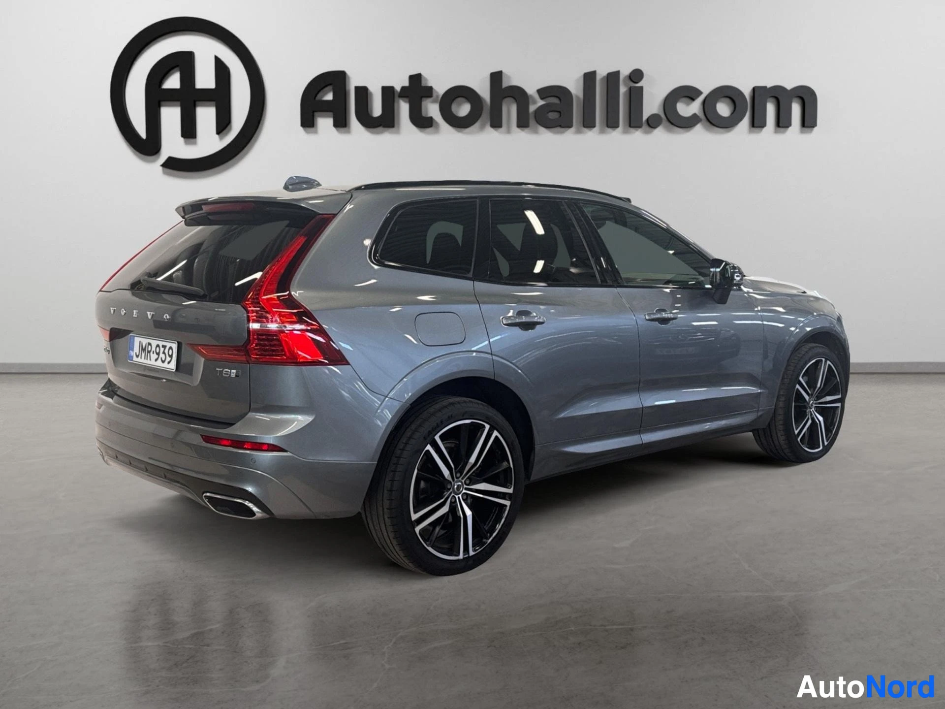 Volvo XC60 hybrid SUV rear three-quarter view showing tail lights and badging
