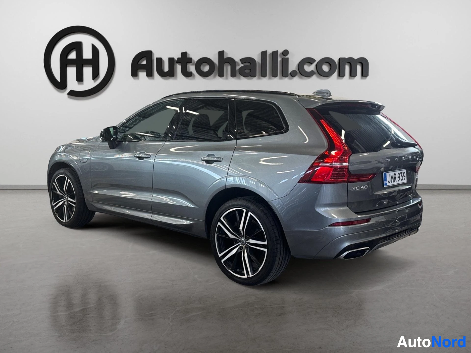 Volvo XC60 hybrid SUV rear three-quarter view from opposite angle with open door