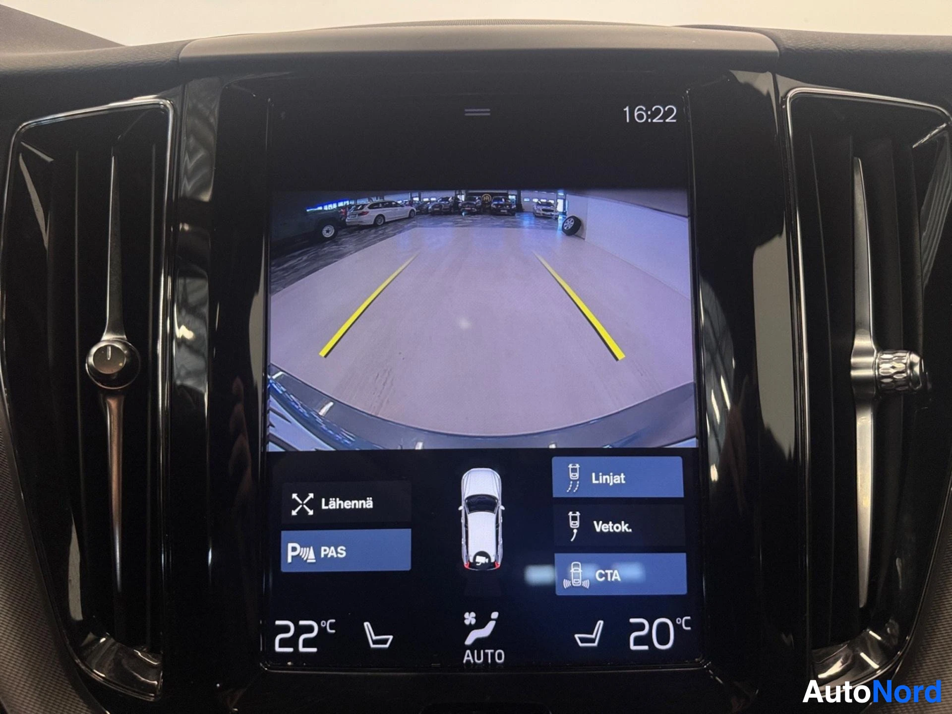 Rear view camera display showing parking area with guidance lines