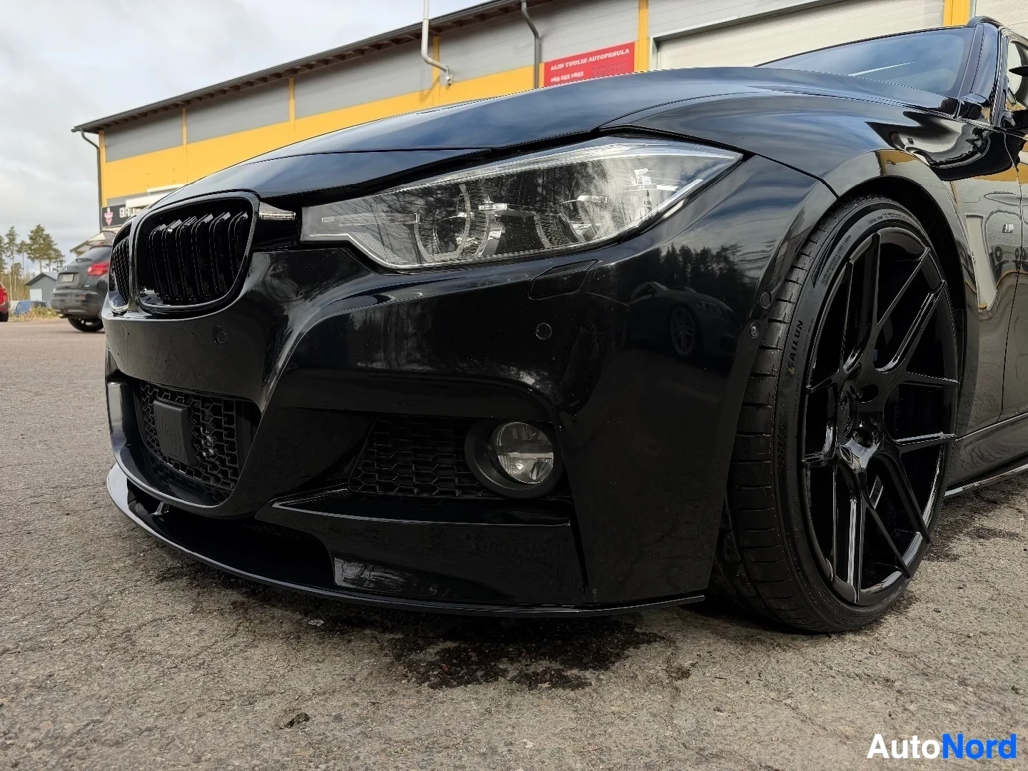 Black BMW front quarter panel with LED headlight and grille detail