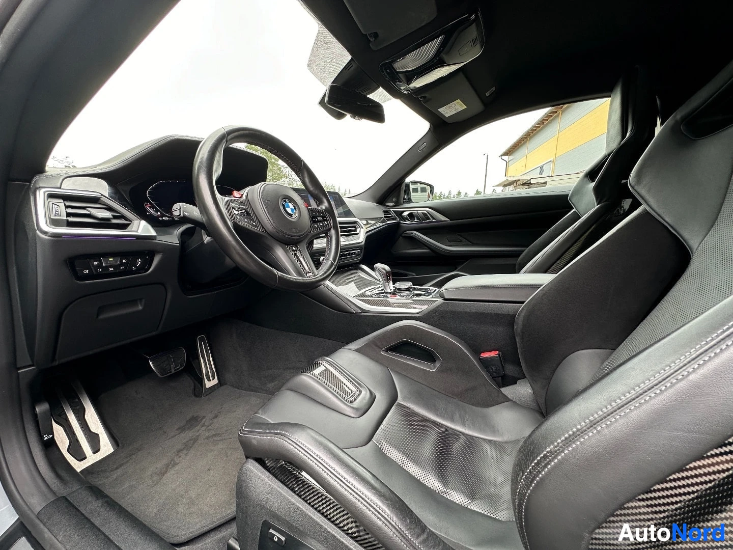 Dashboard and steering wheel view with digital instrument cluster and center console